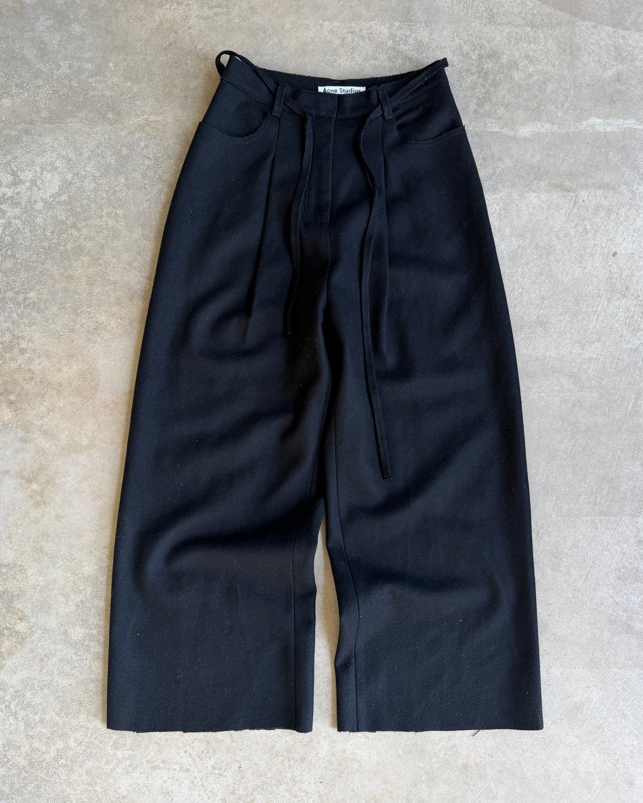 Acne Studios AW2014 Wool Wide Leg Cropped Trousers – XS-on a concrete background