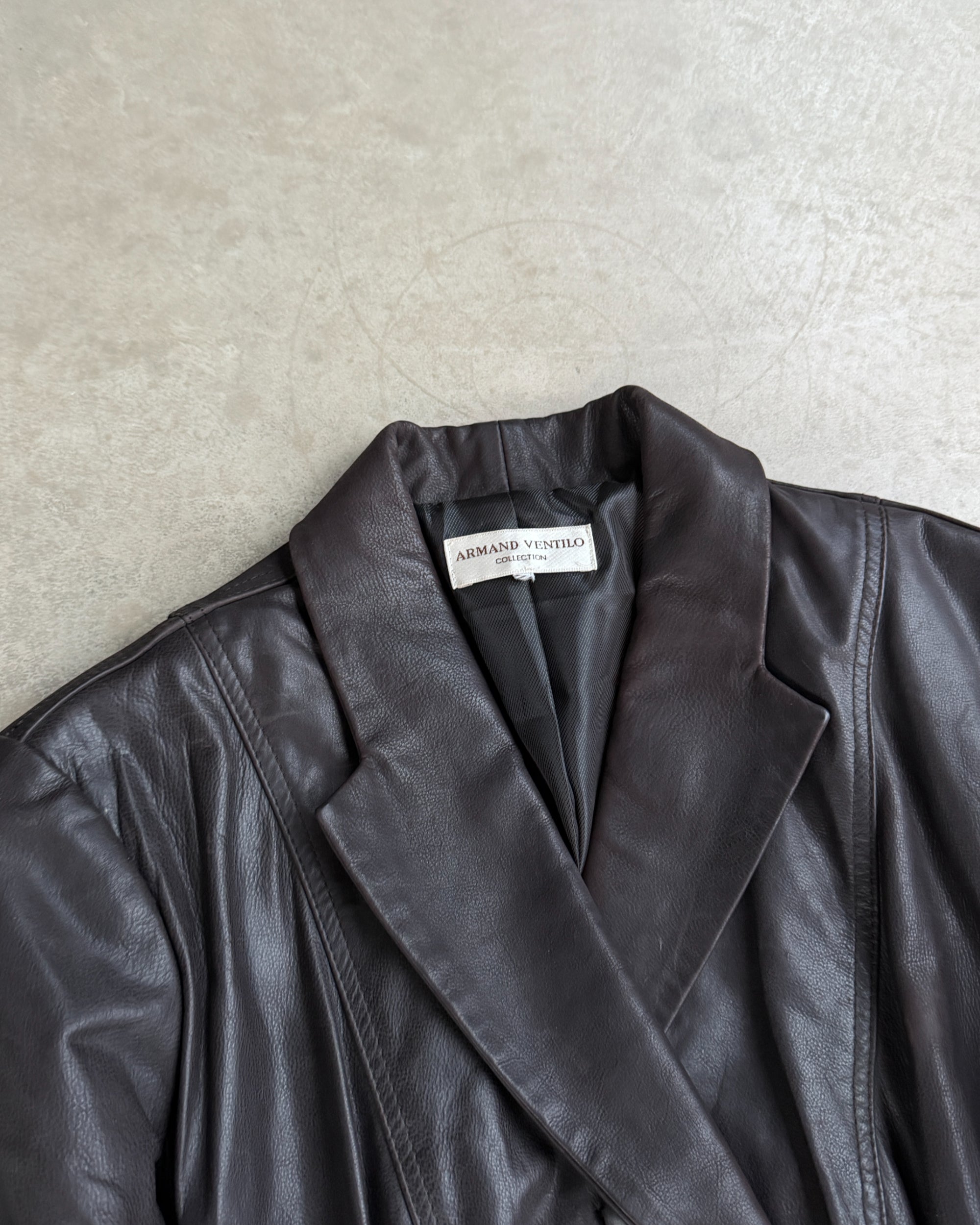 Armand Ventilo Brown Leather Jacket – M-on a concrete background