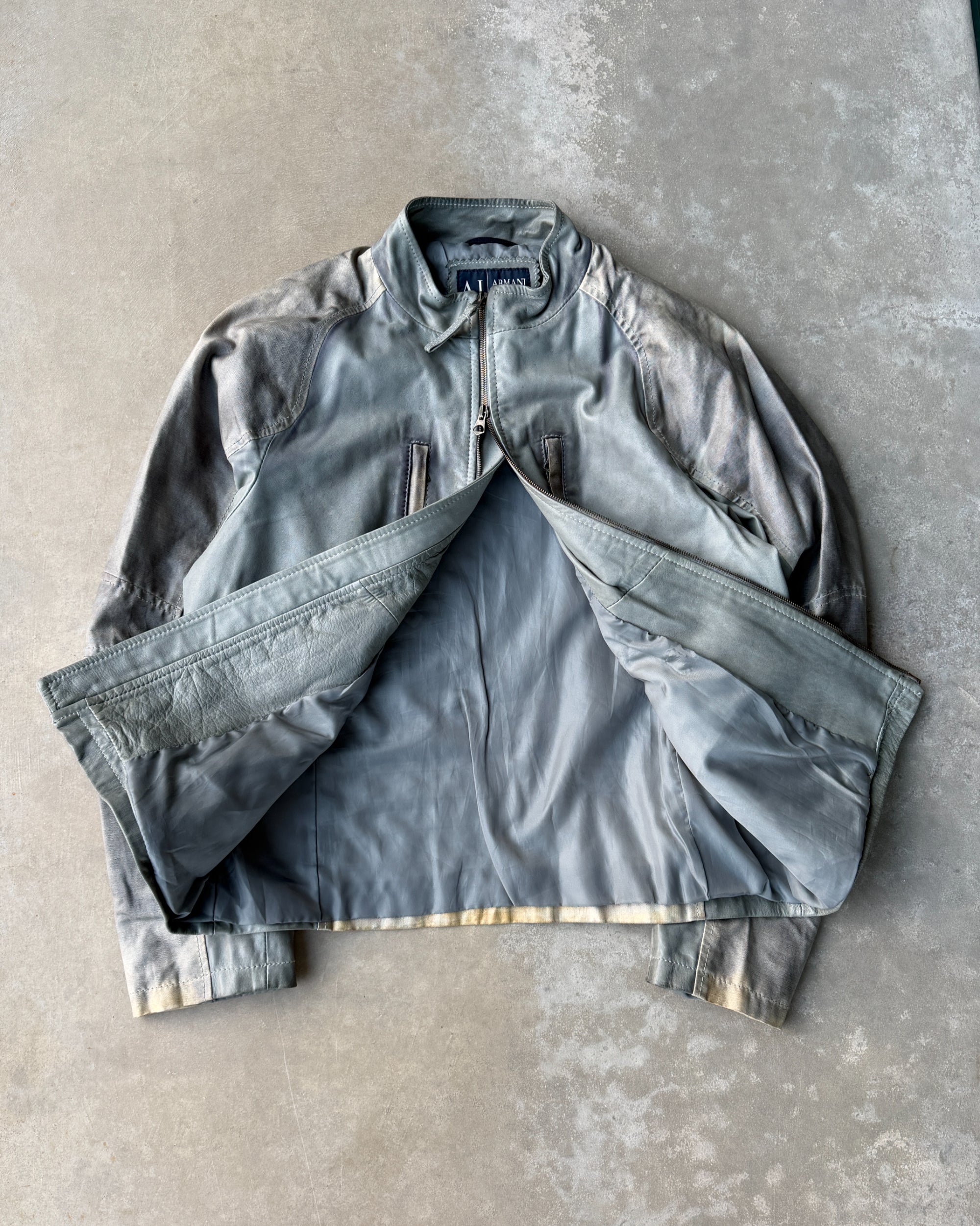 Armani Jeans Distressed Leather Jacket – L-on a concrete background
