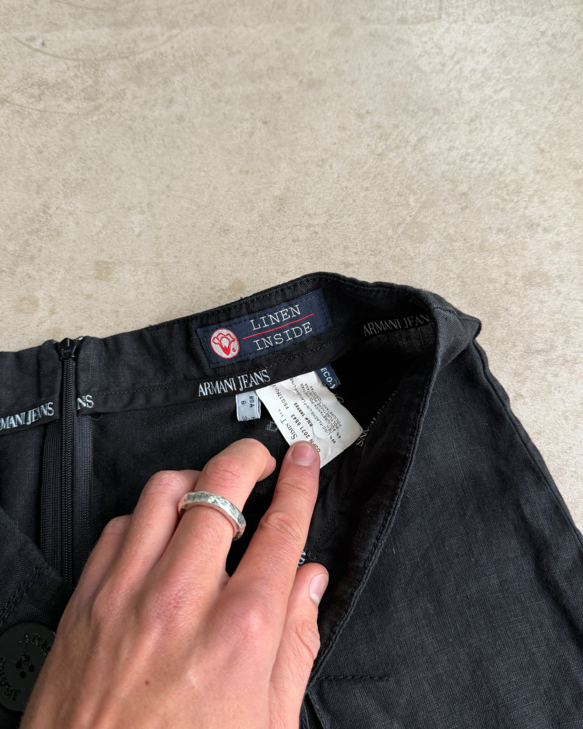 Armani Jeans Linen Mini Skirt – XS-on a concrete background