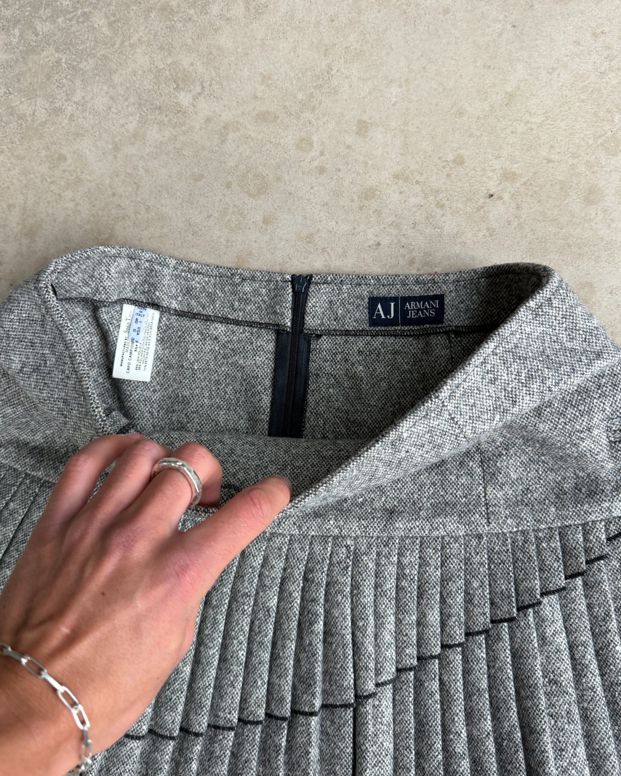 Armani Jeans Wool Pleated Mini Skirt – S-on a concrete background