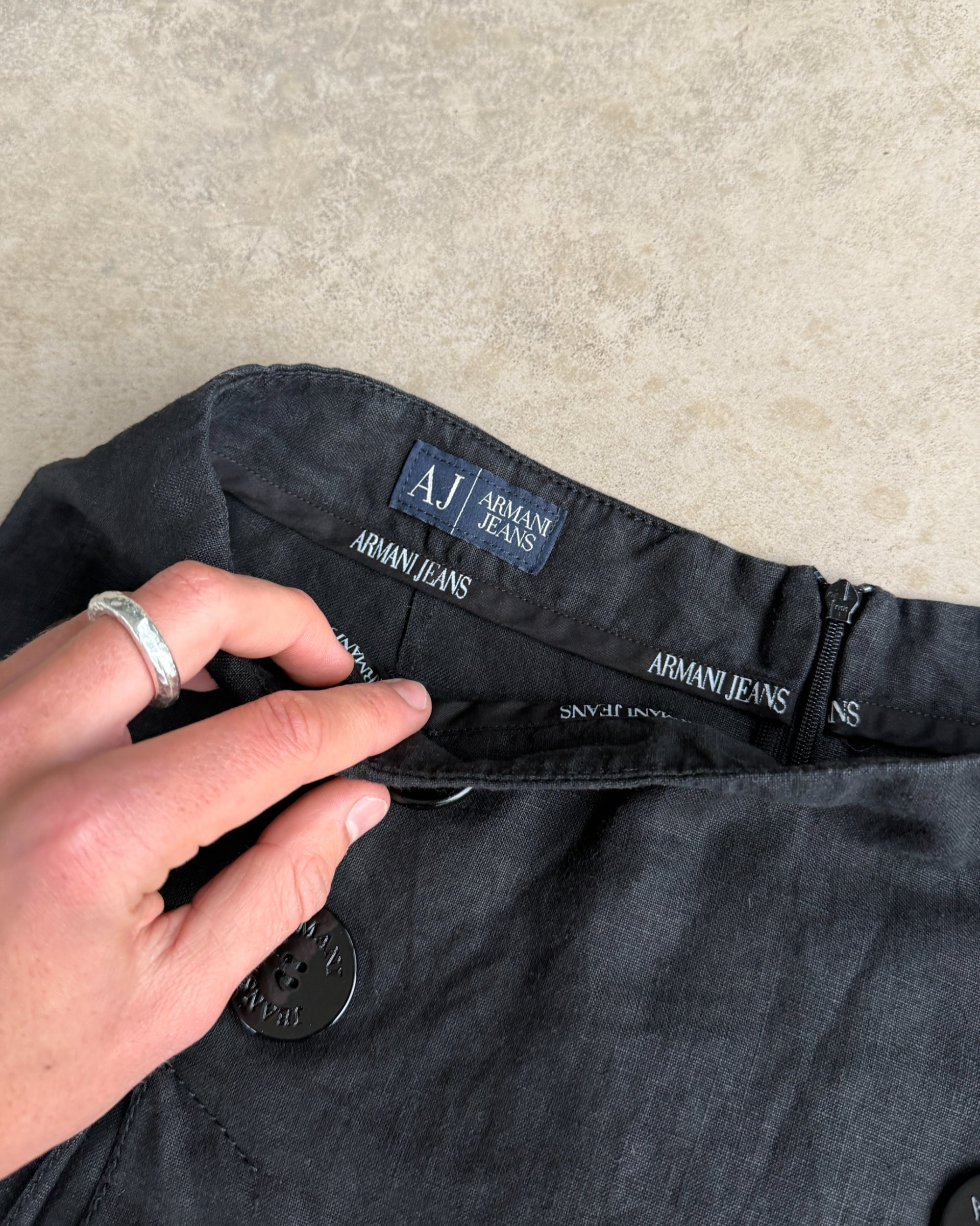 Armani Jeans Linen Mini Skirt – XS-on a concrete background