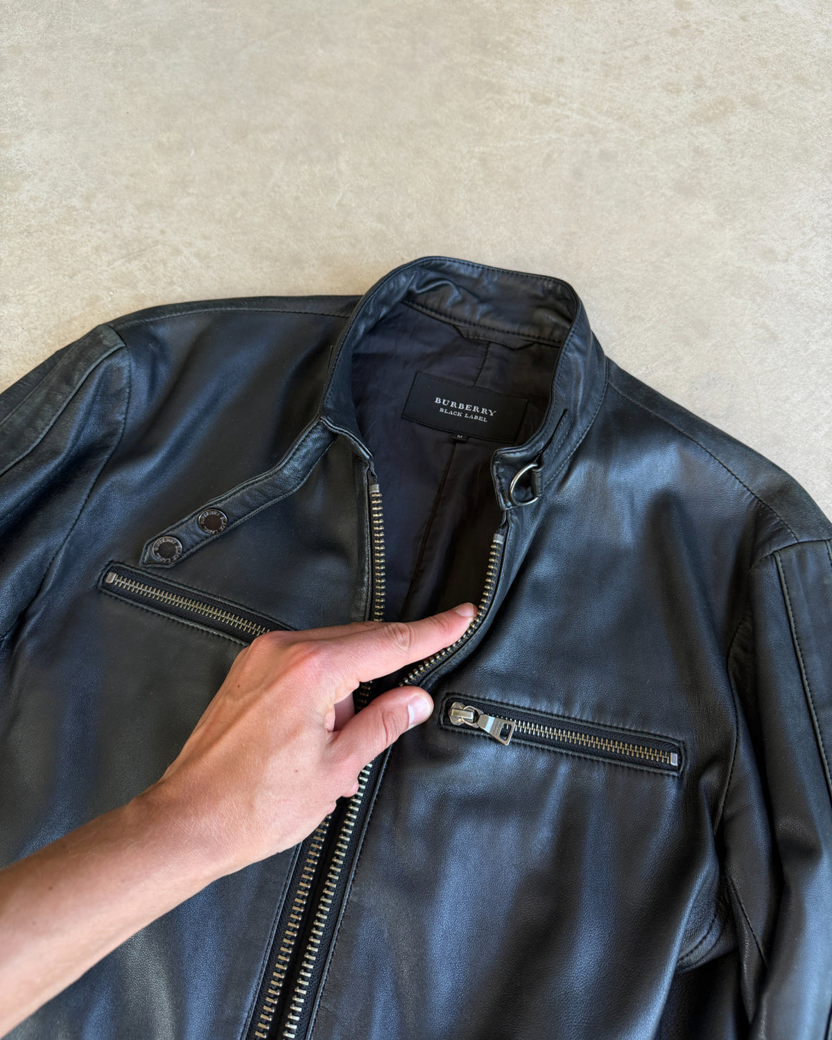 Burberry Black Label Lightweight Leather Jacket – M-on a concrete background