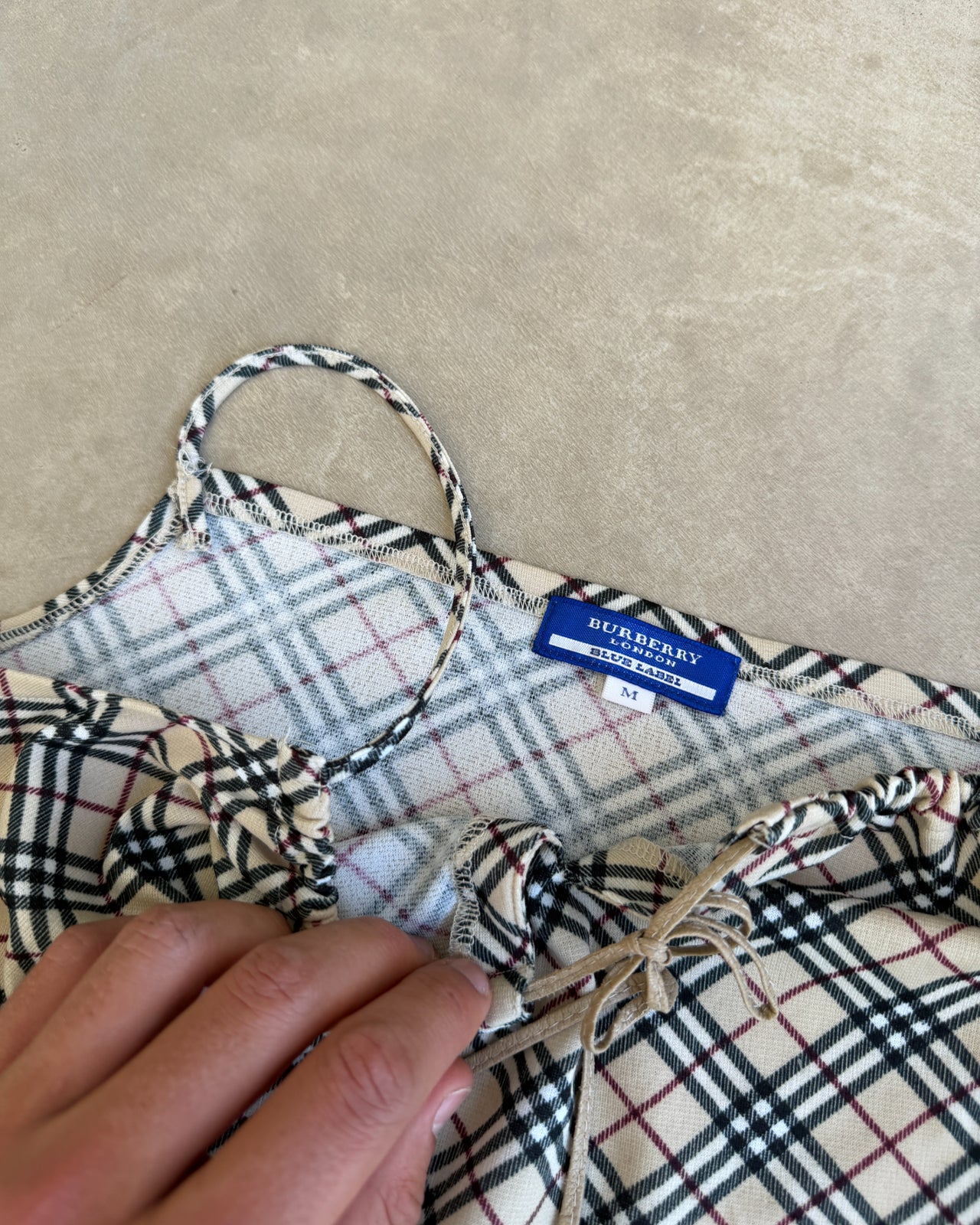 Burberry Blue Label Nova Print Vest Top – M-on a concrete background