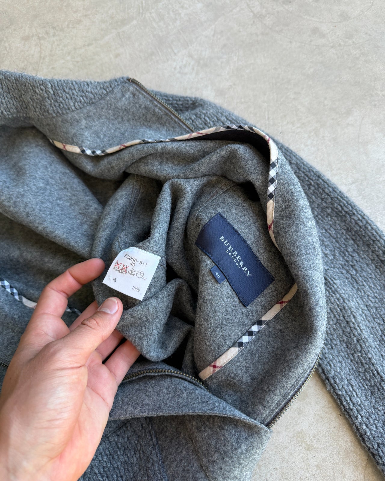 Burberry Grey Wool Knit Zip Up Sweatshirt – S-on a concrete background
