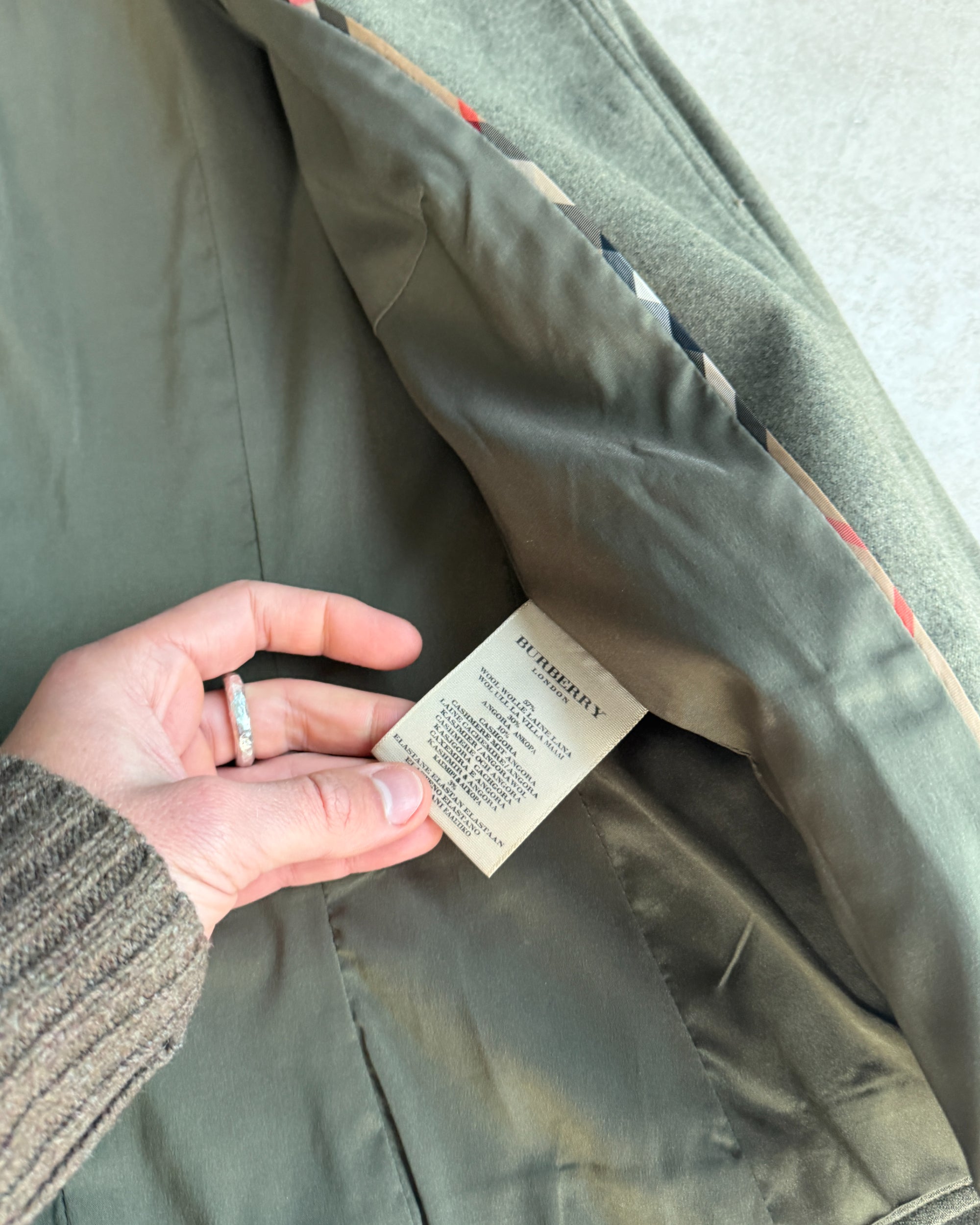 Burberry Wool and Cashmere Military Jacket – S-on a concrete background