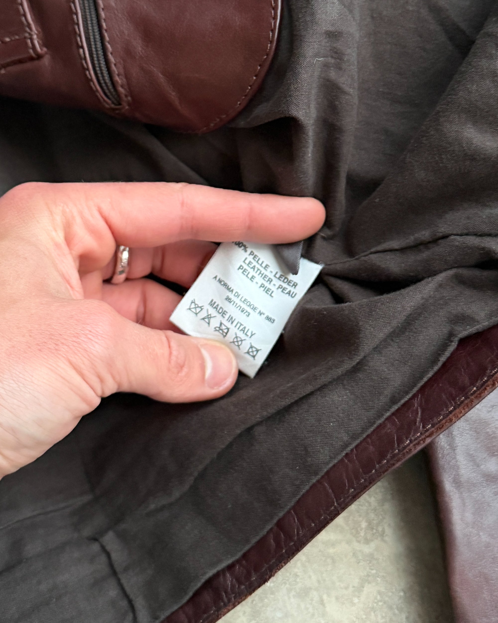 Calvin Klein Buckle Leather Jacket – M-on a concrete background