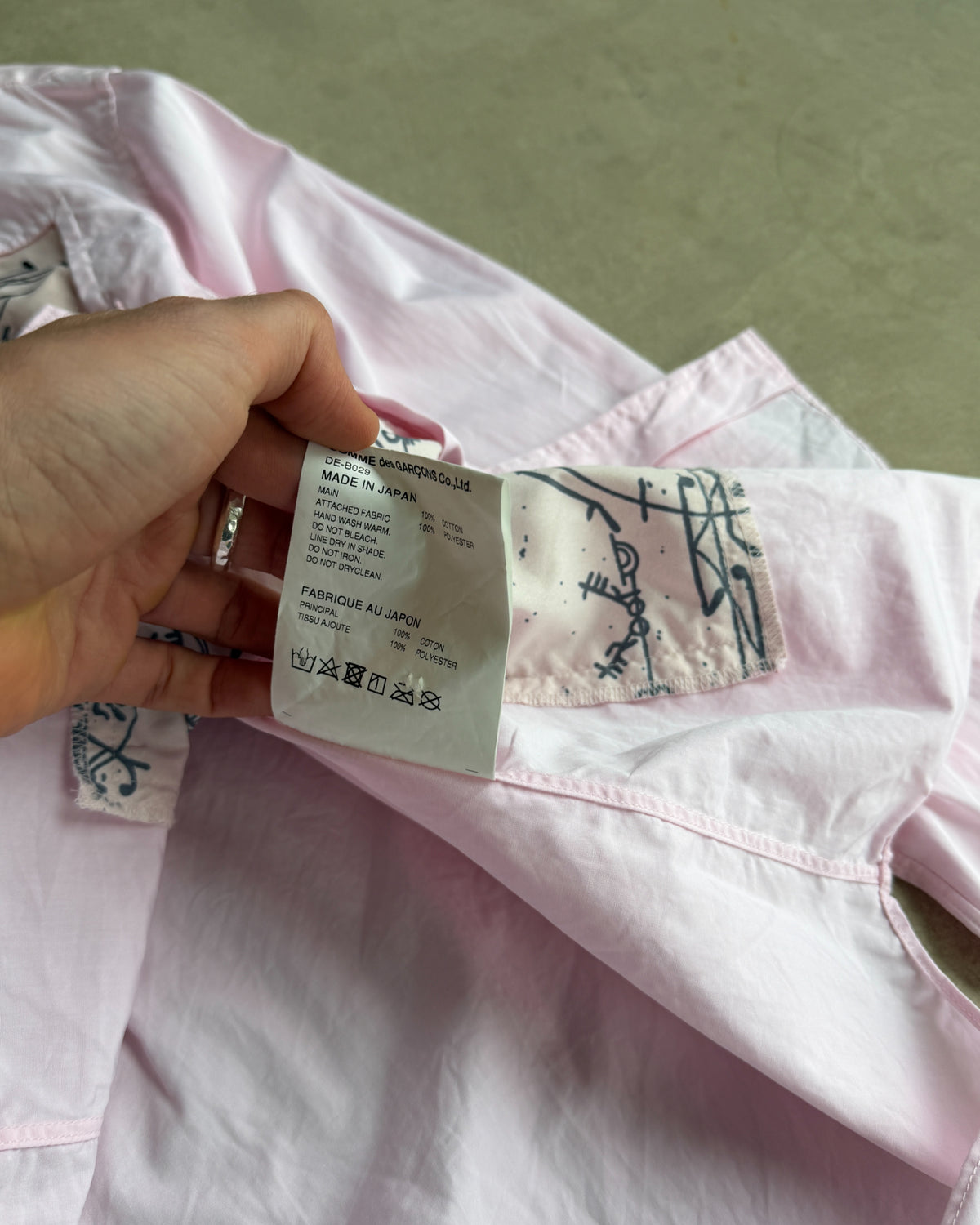 Comme des Garçons Homme Deux AW19 Shirt – S-on a concrete background