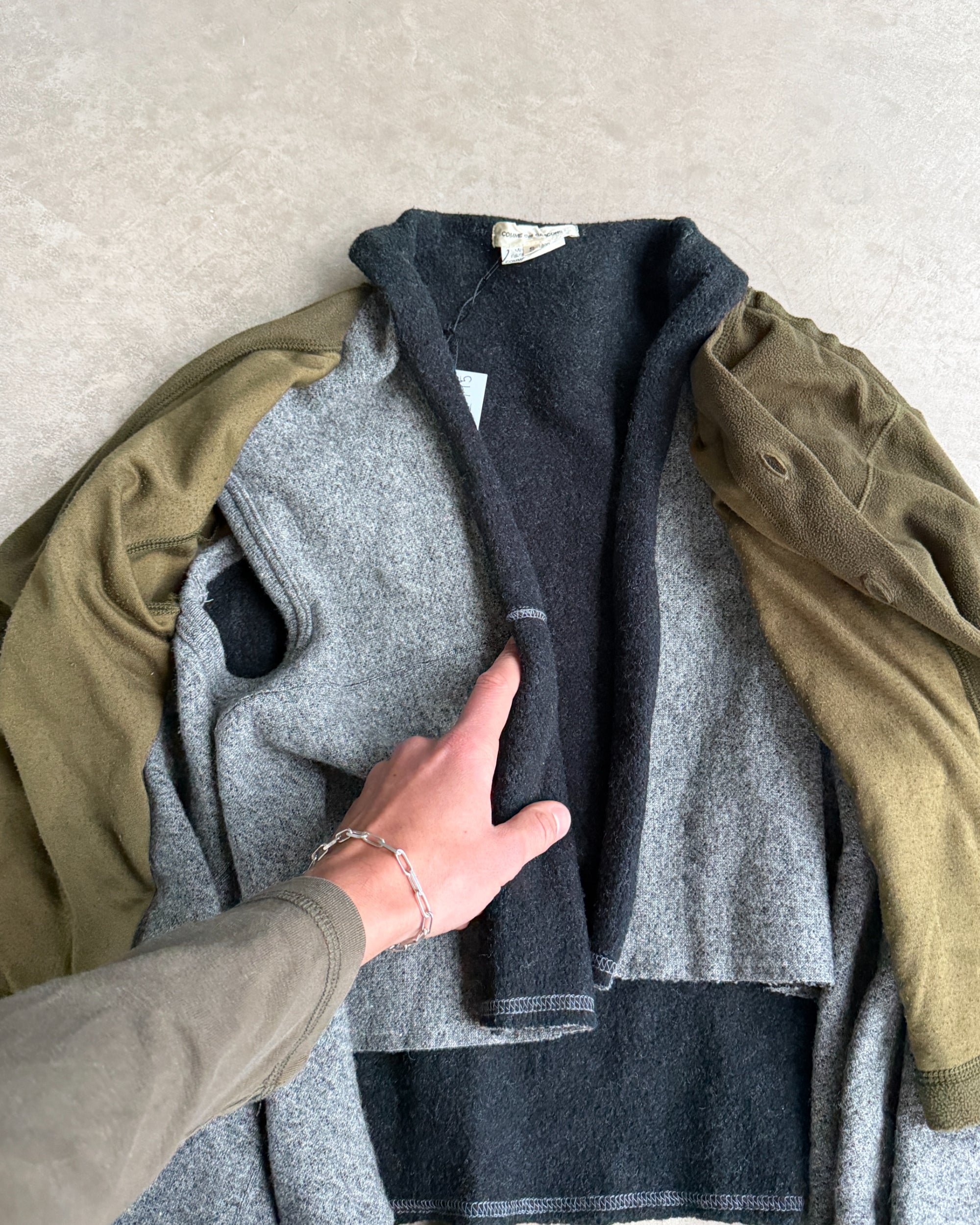 Comme des Garçons 2009 Layered Armhole Cardigan – XS–S-on a concrete background