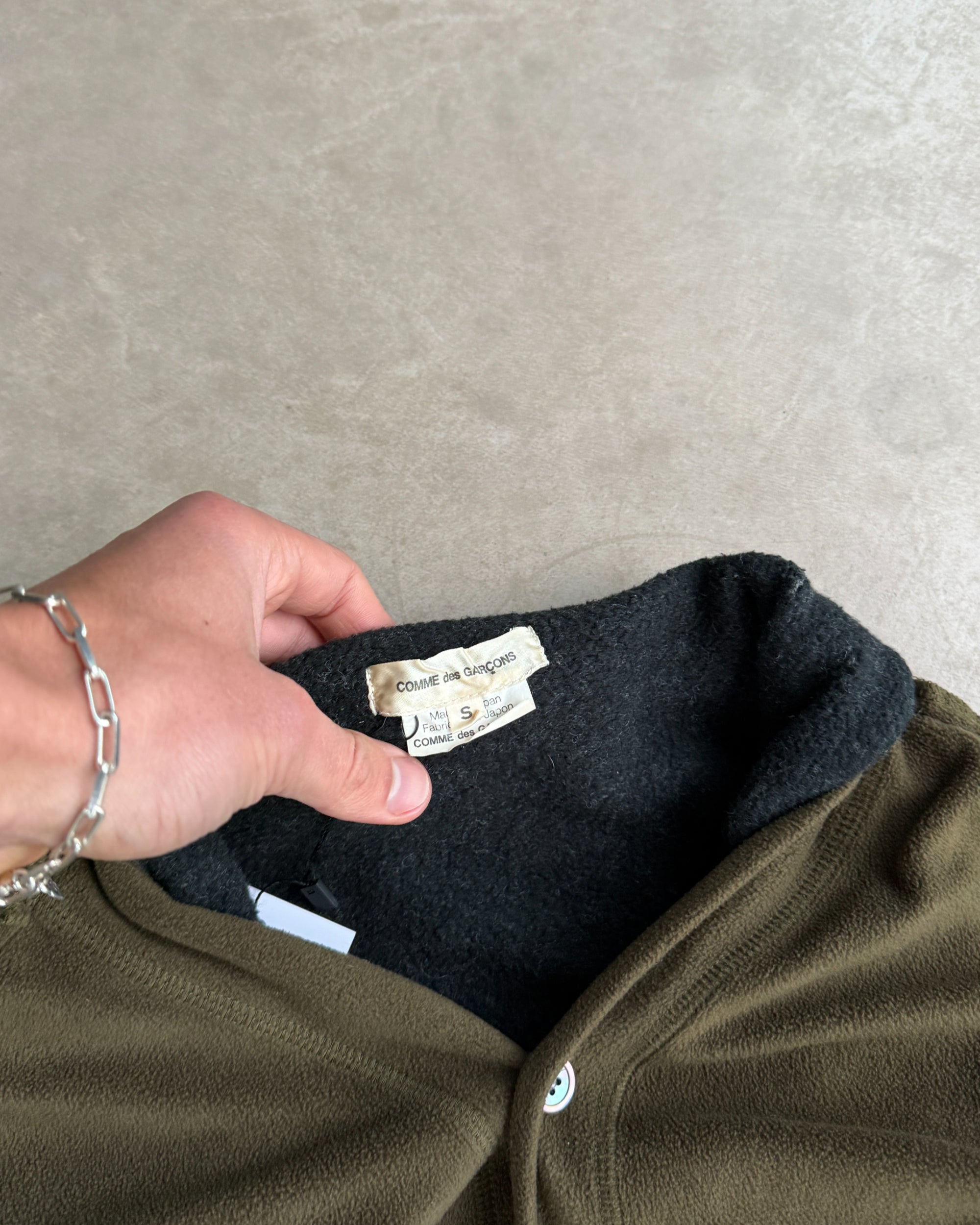 Comme des Garçons 2009 Layered Armhole Cardigan – XS–S-on a concrete background