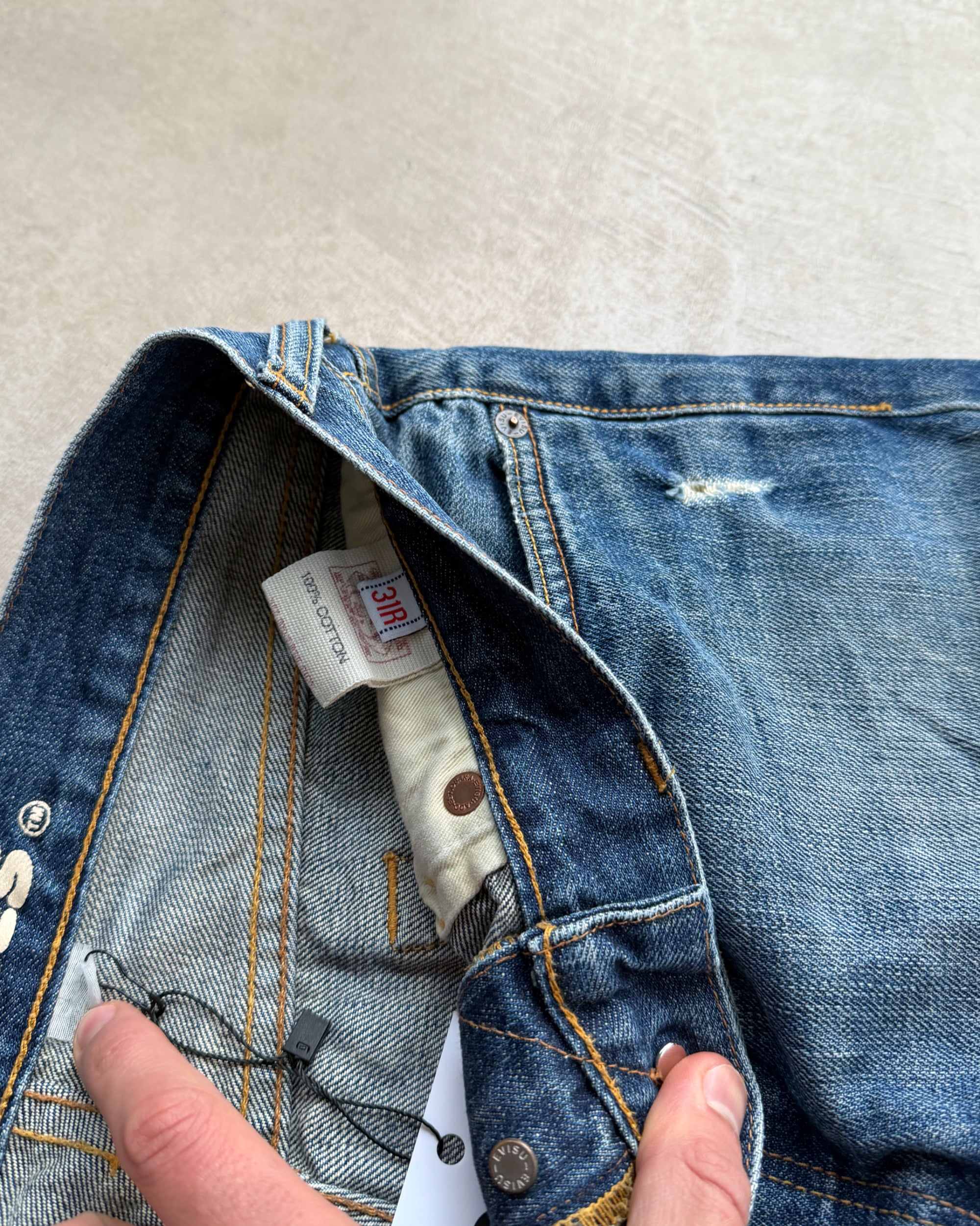 Vintage Evisu Jeans – W30–31-on a concrete background