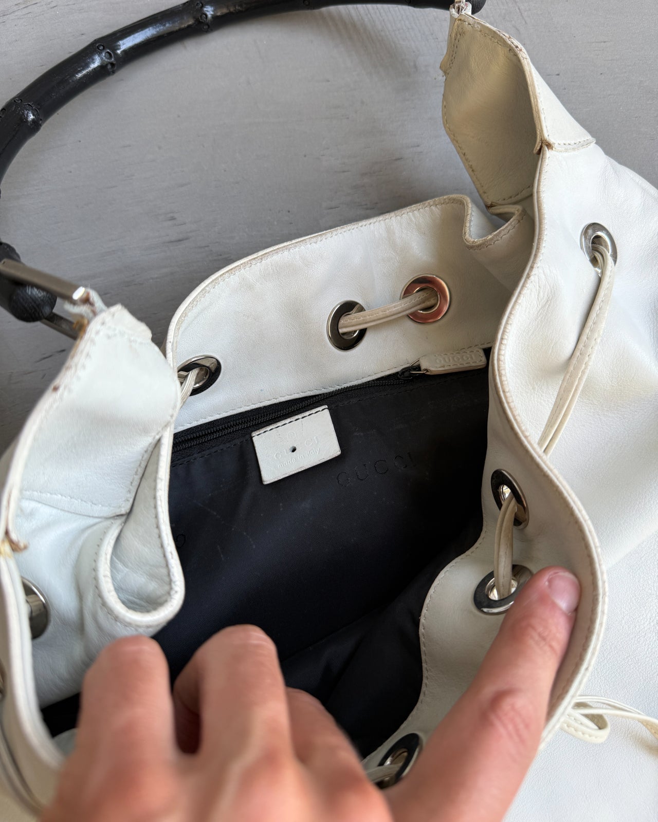 Gucci by Tom Ford White Leather Bag-on a concrete background