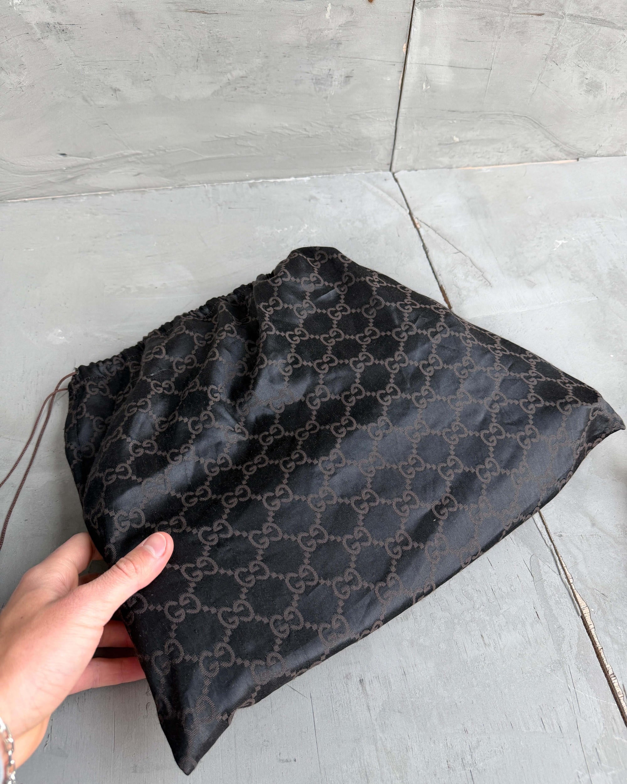 Gucci by Tom Ford Ruched Leather Shoulder Bag-on a concrete background