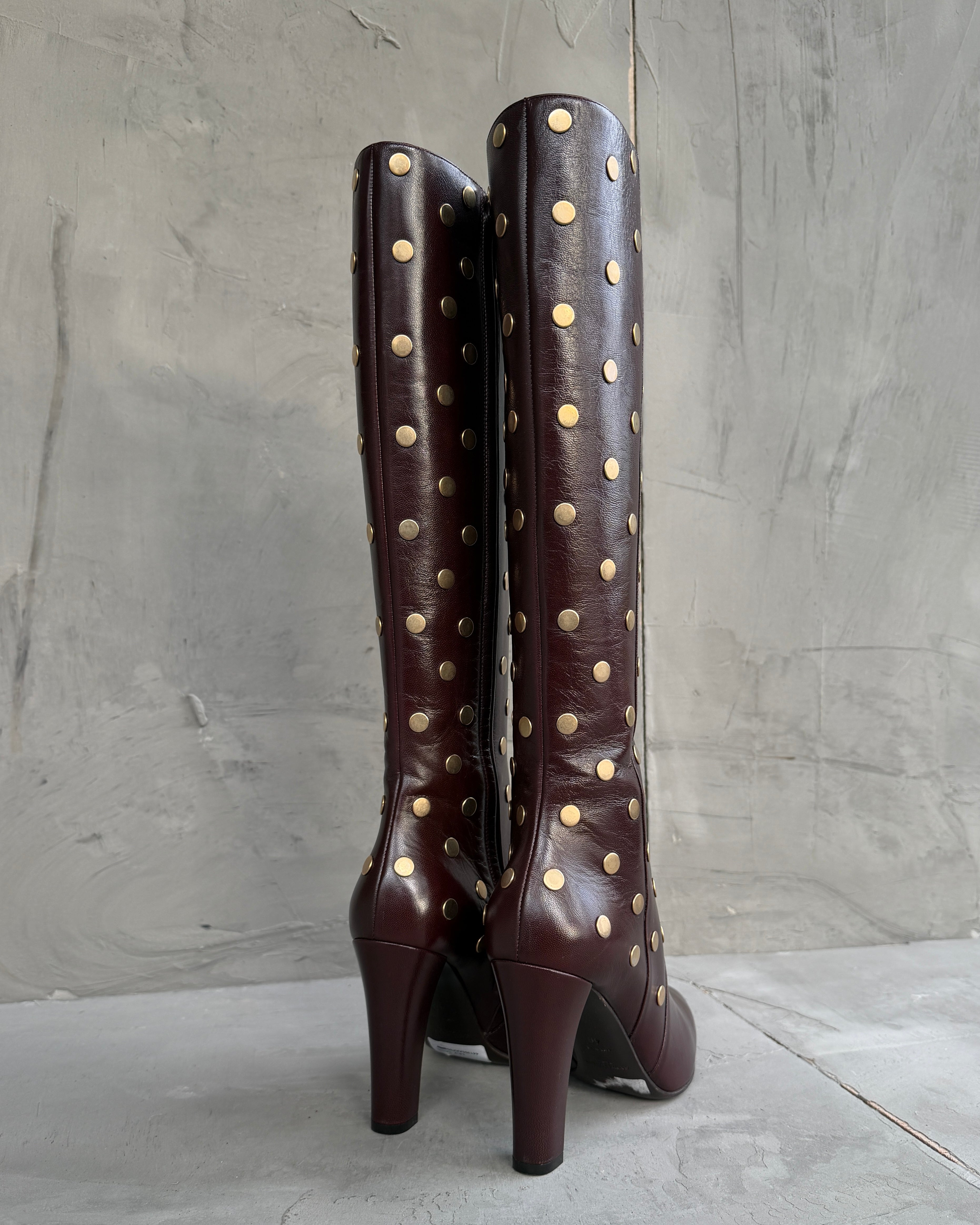 Saint Laurent Studded Leather Heeled Boots – EU 40-on a concrete background