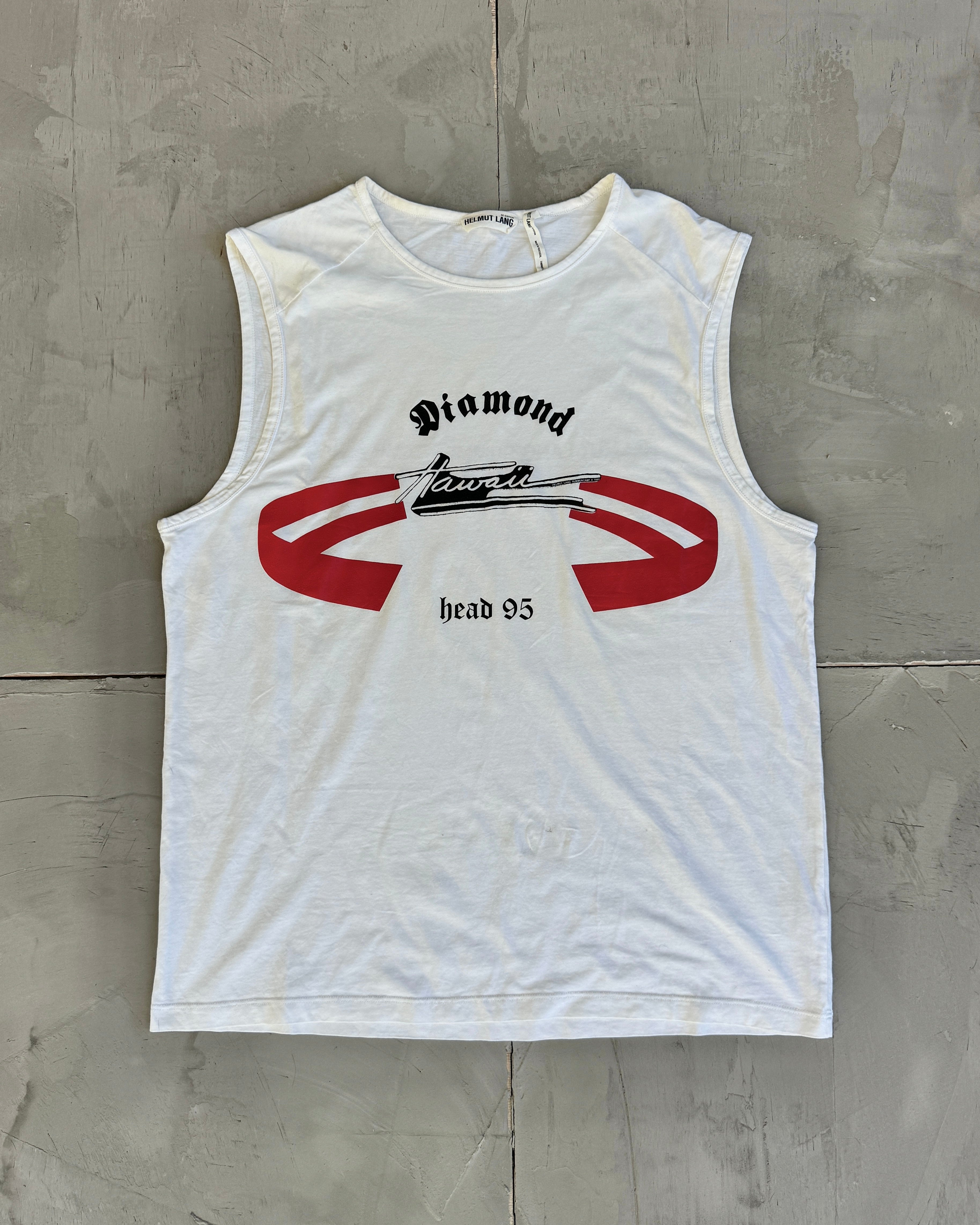 White sleeveless shirt with red and black graphics on a gray concrete surface