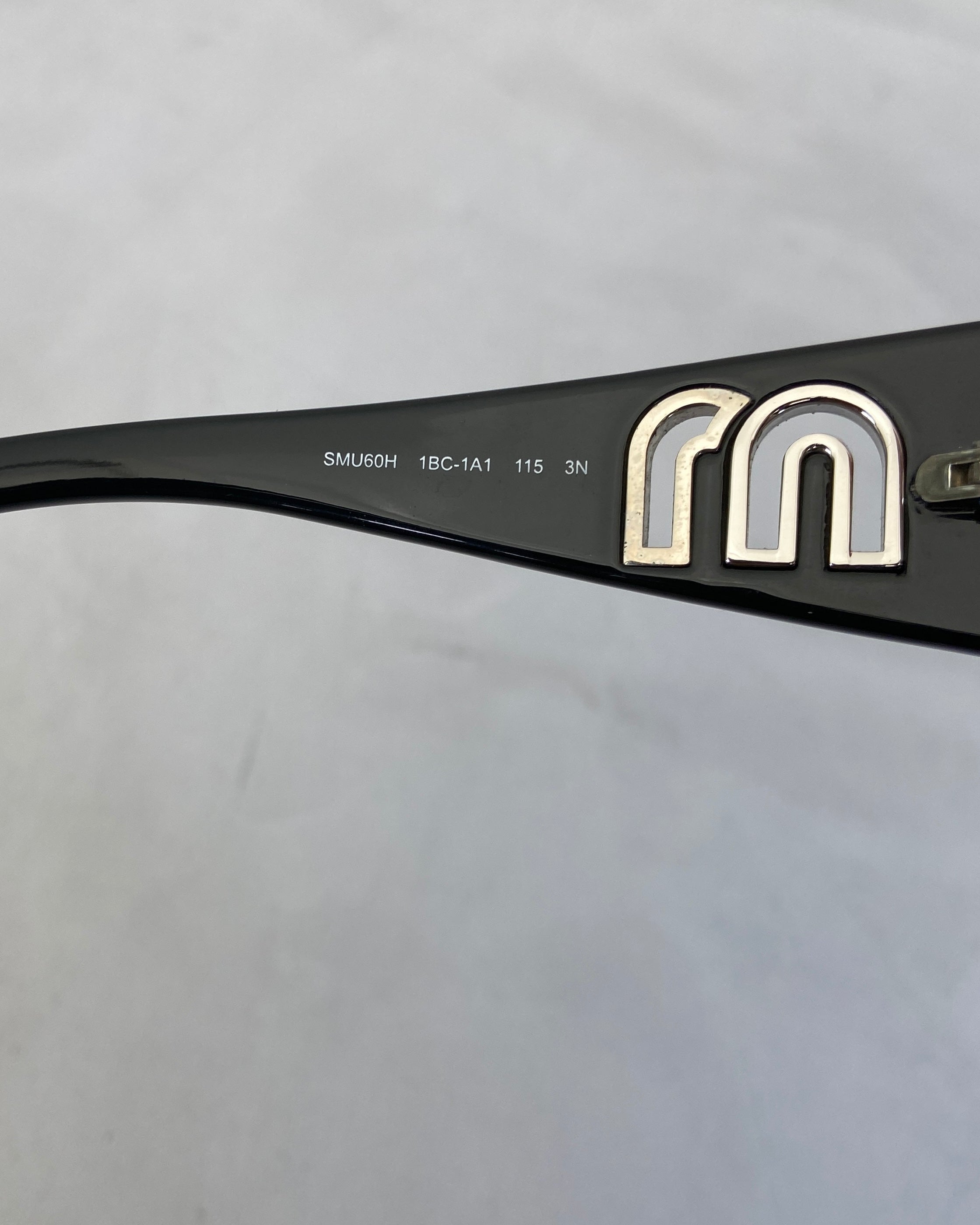 MIU MIU CUTOUT WRAP SUNGLASSES