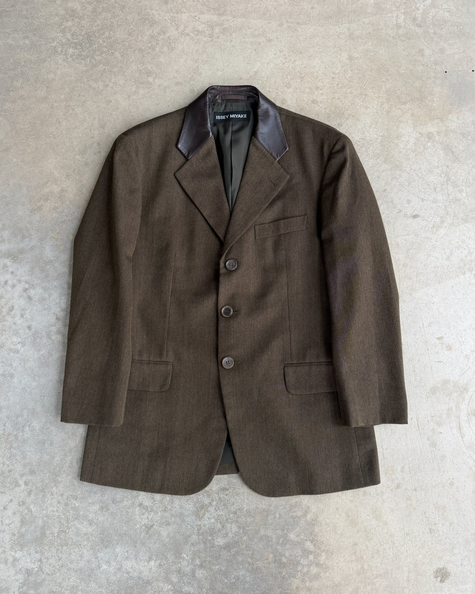 Issey Miyake AW2013 Wool Blazer with Leather Collar – M-on a concrete background