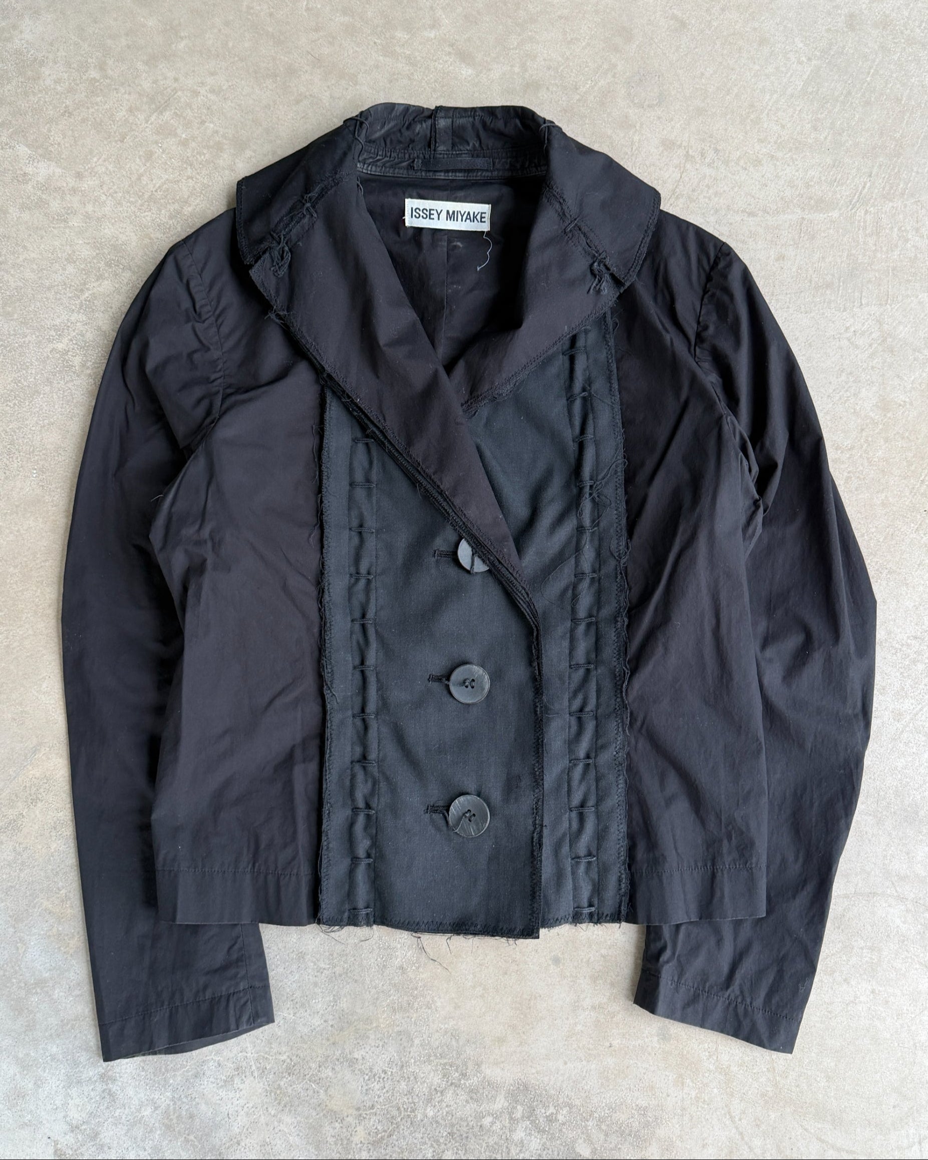Issey Miyake SS03 Distressed Cotton Jacket – M-on a concrete background