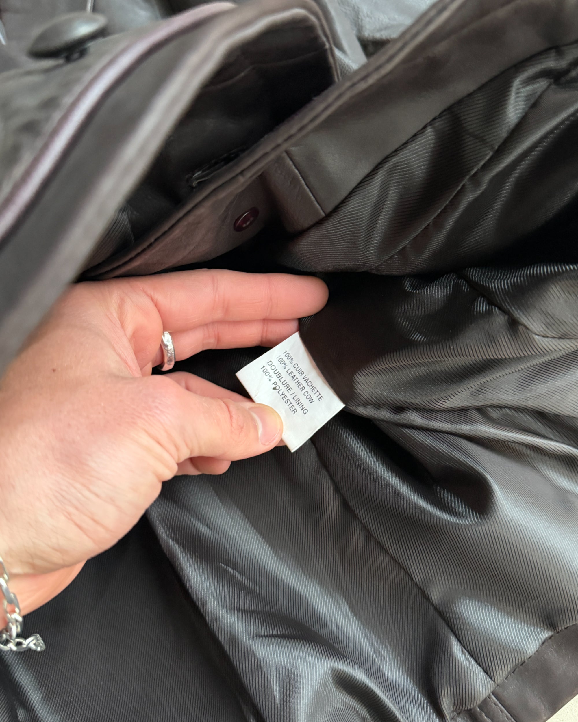 Armand Ventilo Brown Leather Jacket – M-on a concrete background