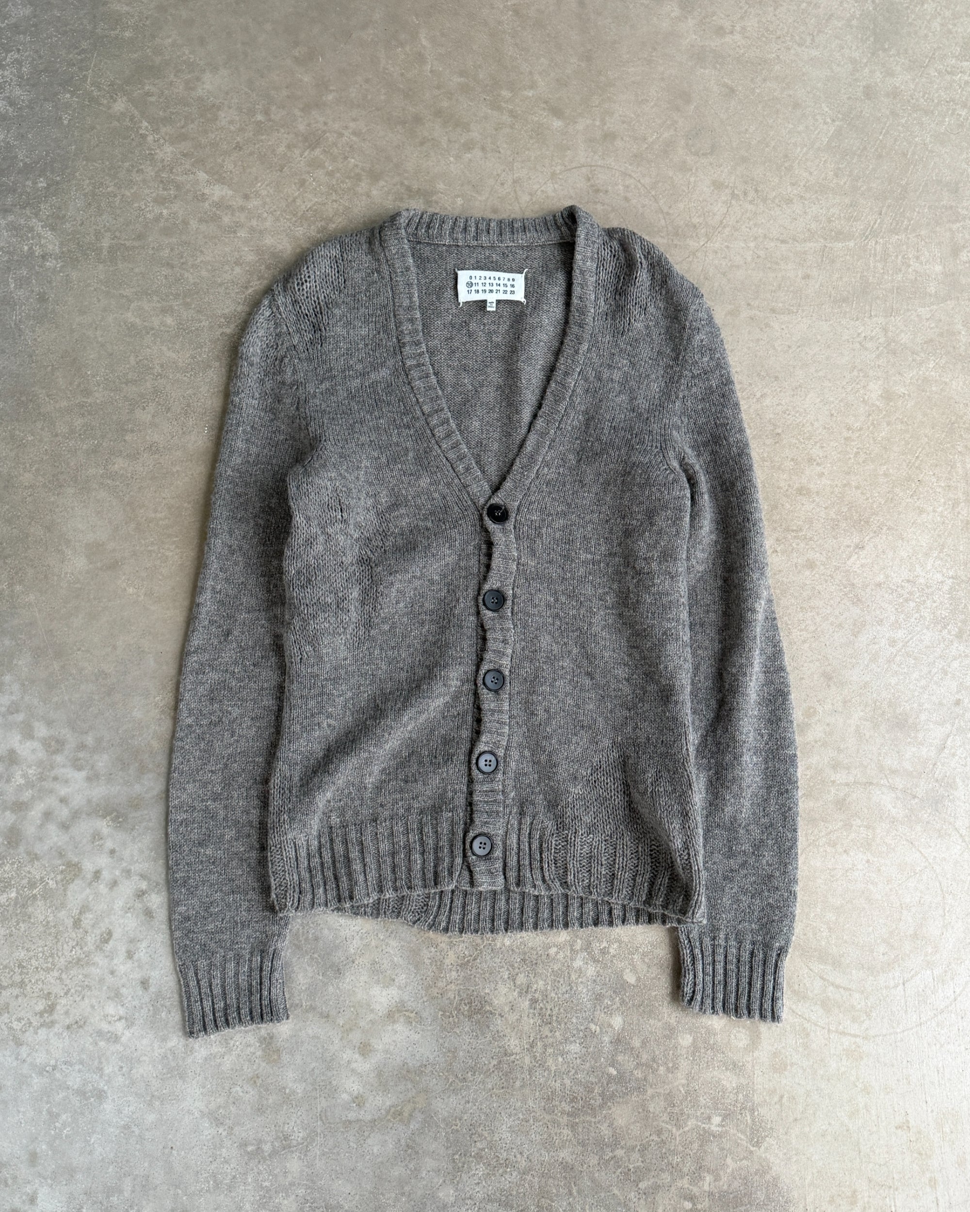 Maison Margiela 10 Wool Cardigan – S-on a concrete background