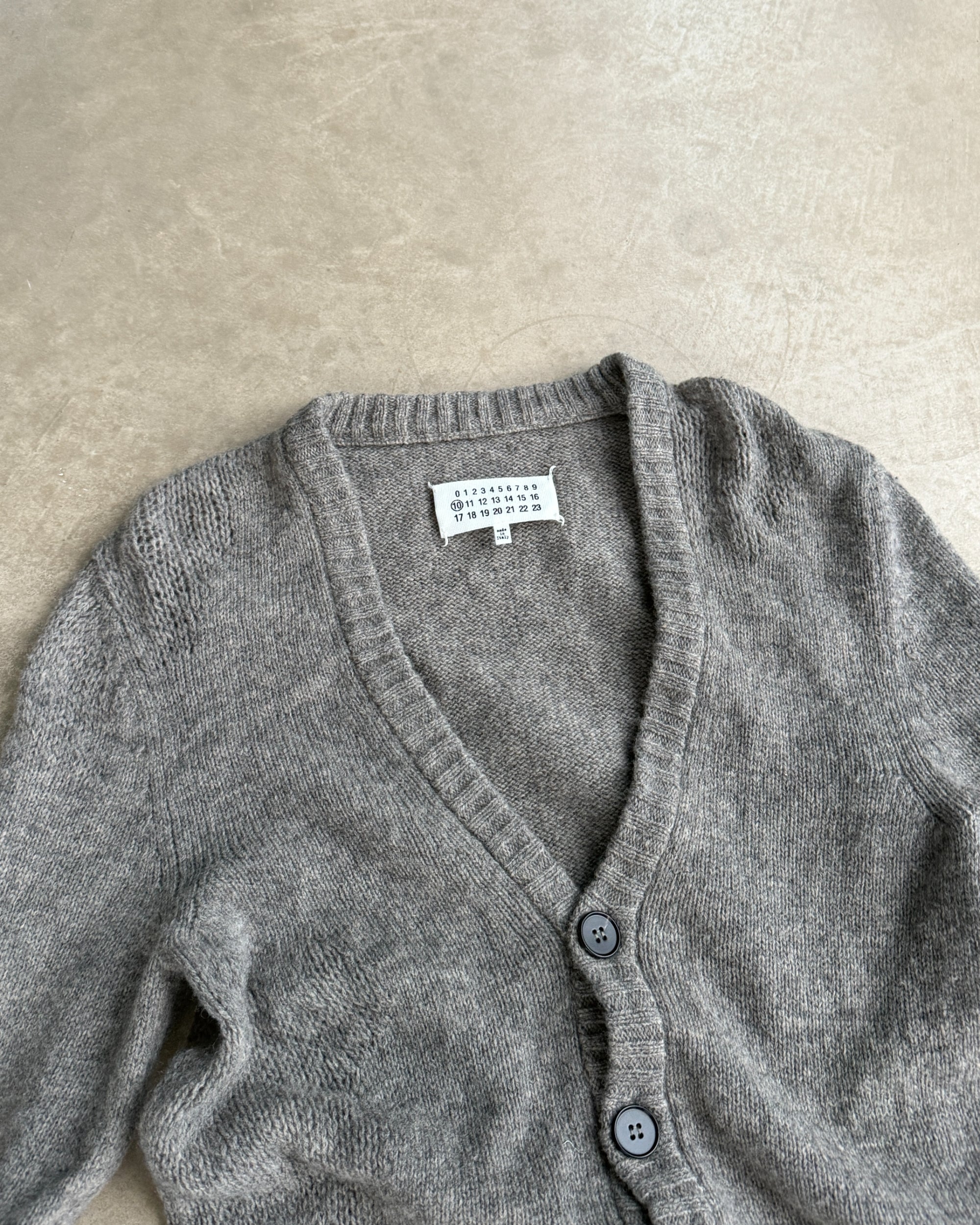 Maison Margiela 10 Wool Cardigan – S-on a concrete background