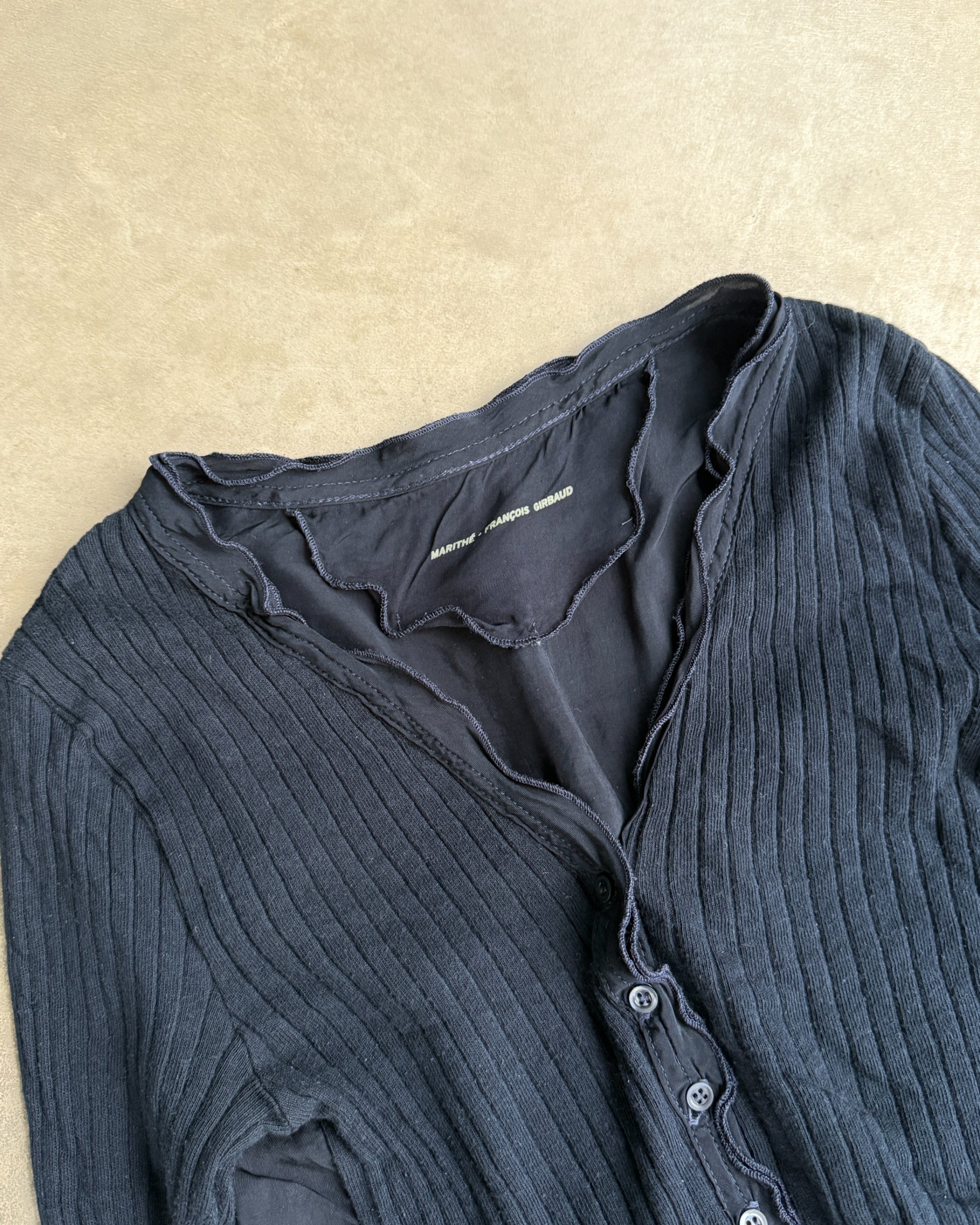 Marithé + François Girbaud MFG Button-Up Top – S-on a concrete background
