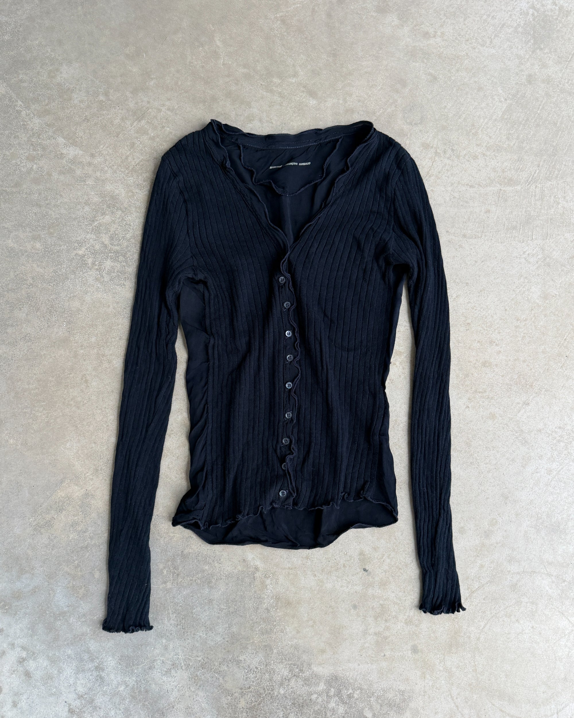 Marithé + François Girbaud MFG Button-Up Top – S-on a concrete background