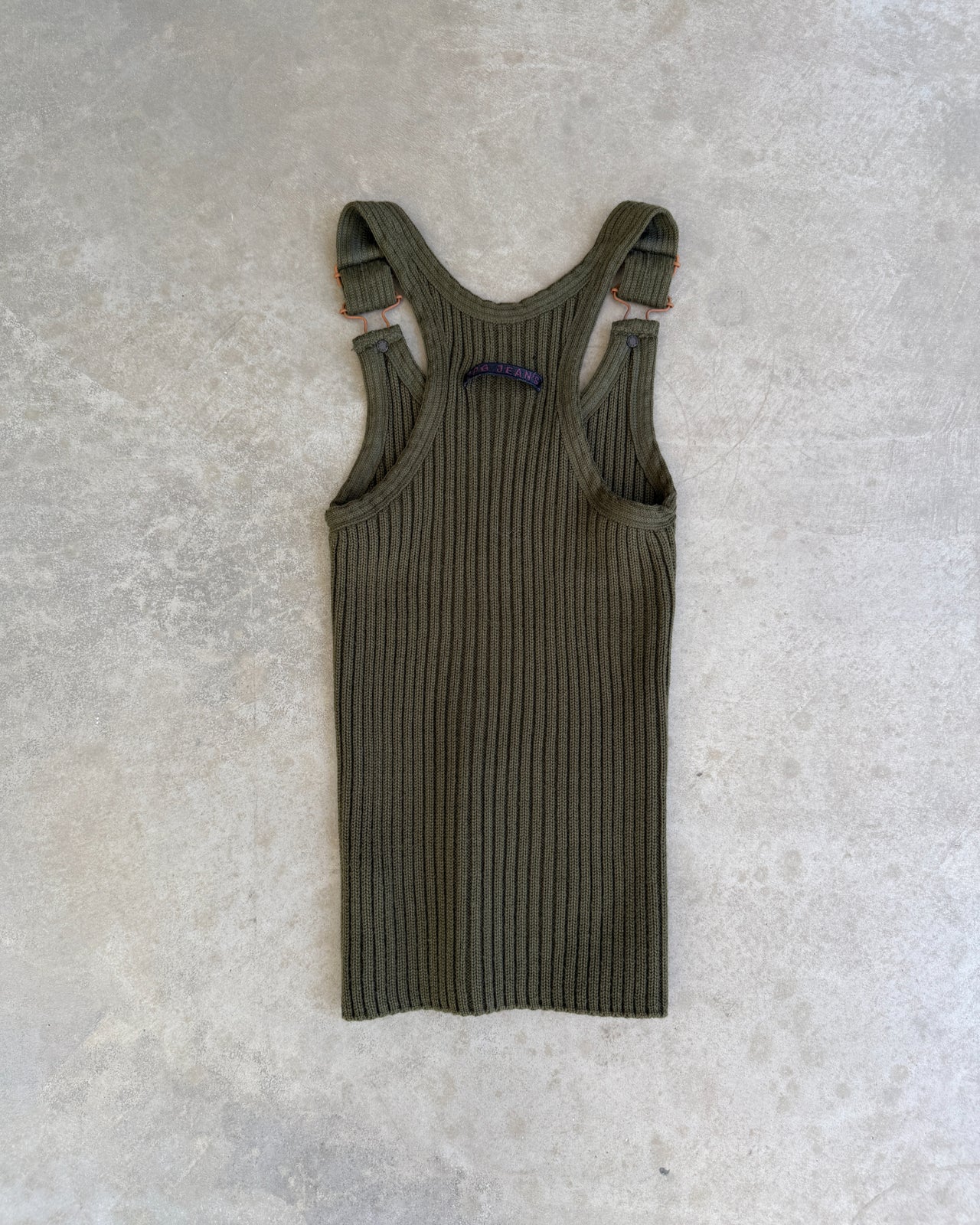 JPG Jeans Ripped Dark Green Tank Top – S-on a concrete background
