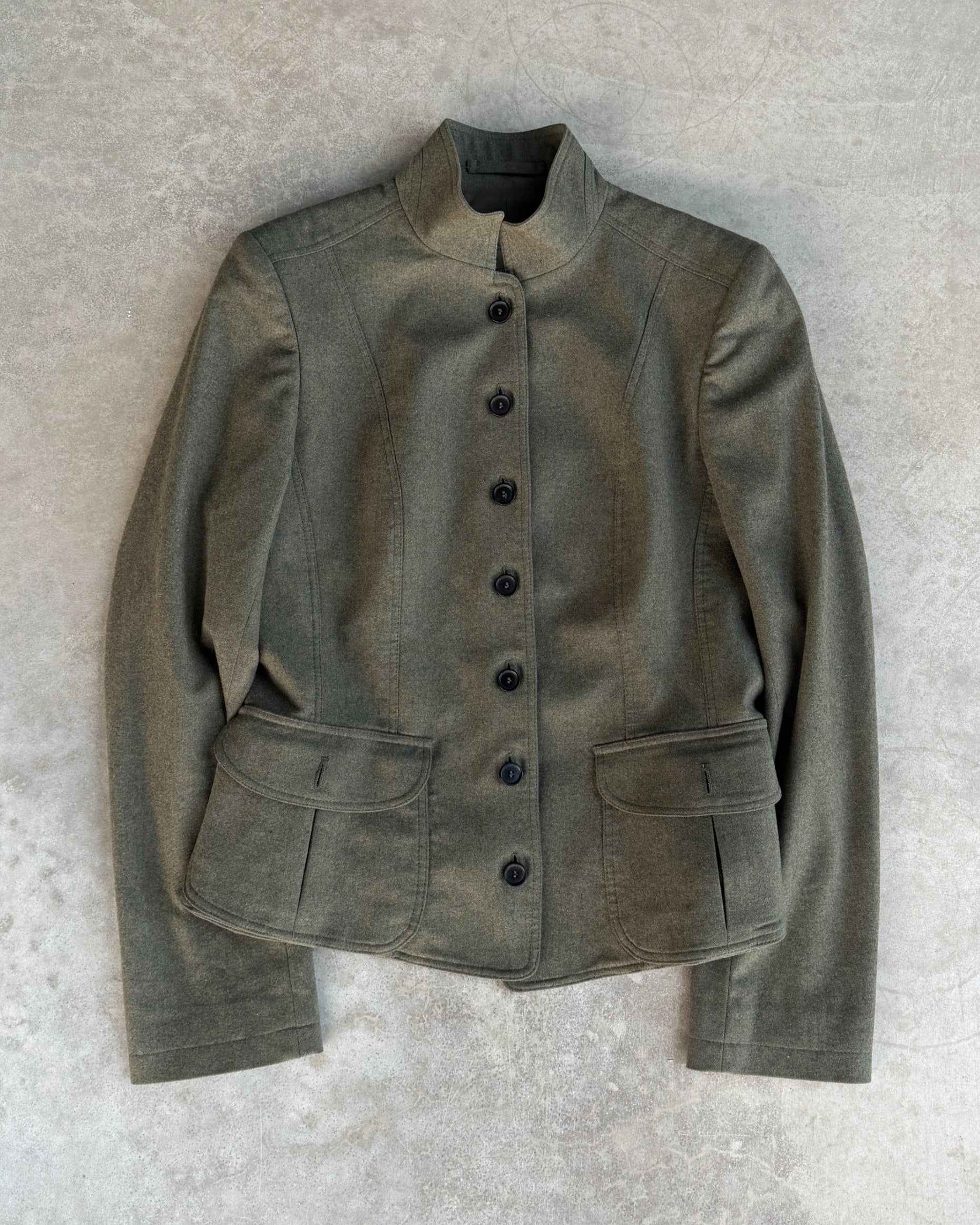 Burberry Wool and Cashmere Military Jacket – S-on a concrete background