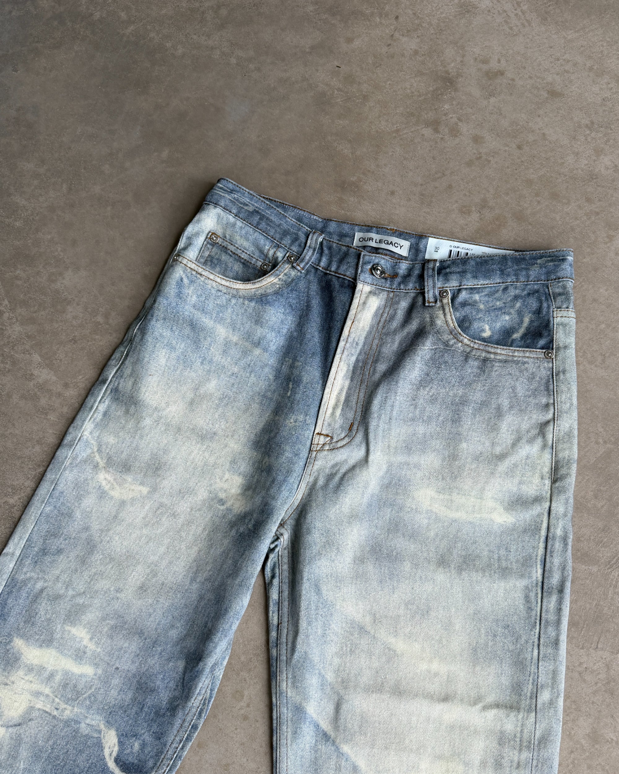Our Legacy Third Cut Digital Print Distressed Denim Jeans – W30–32-on a concrete background