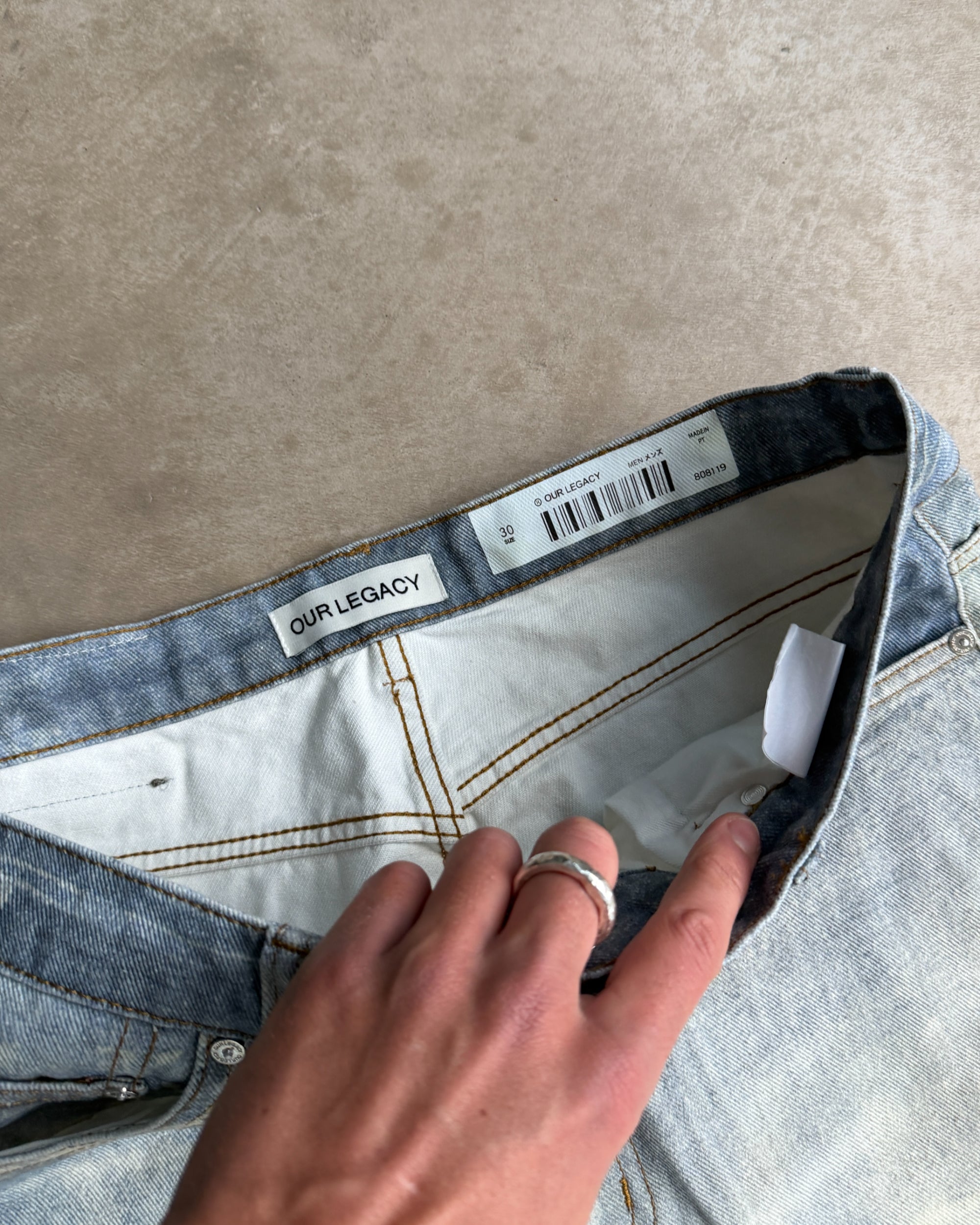 Our Legacy Third Cut Digital Print Distressed Denim Jeans – W30–32-on a concrete background