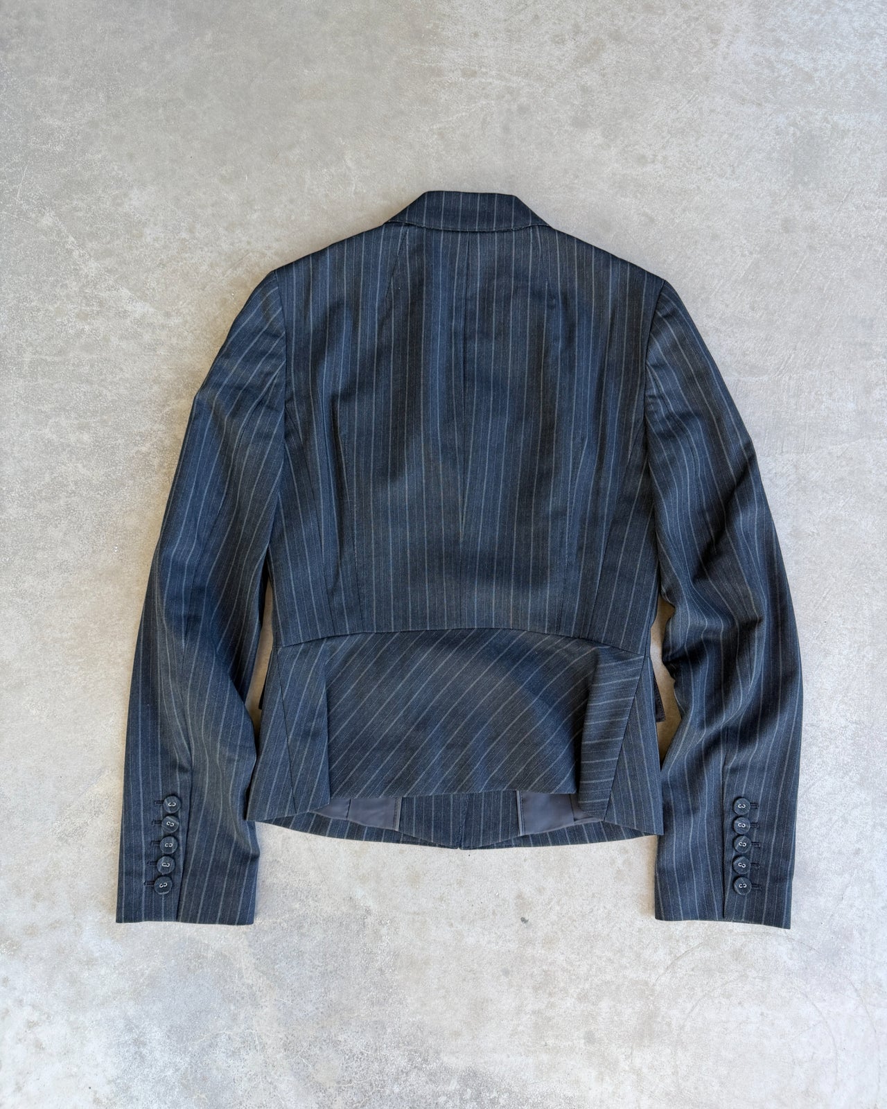 Calvin Klein Grey Pinstripe Suit – XS/S-on a concrete background