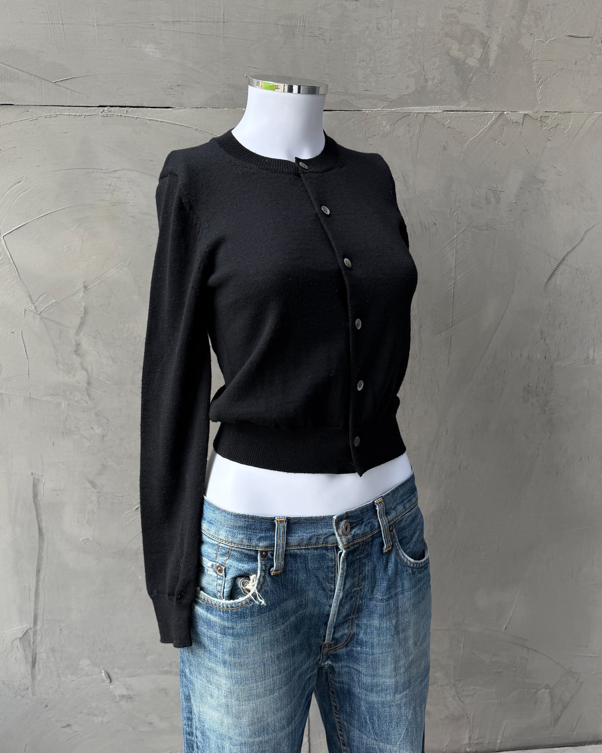 Comme des Garçons 2015 Wool Cardigan – XS-on a concrete background