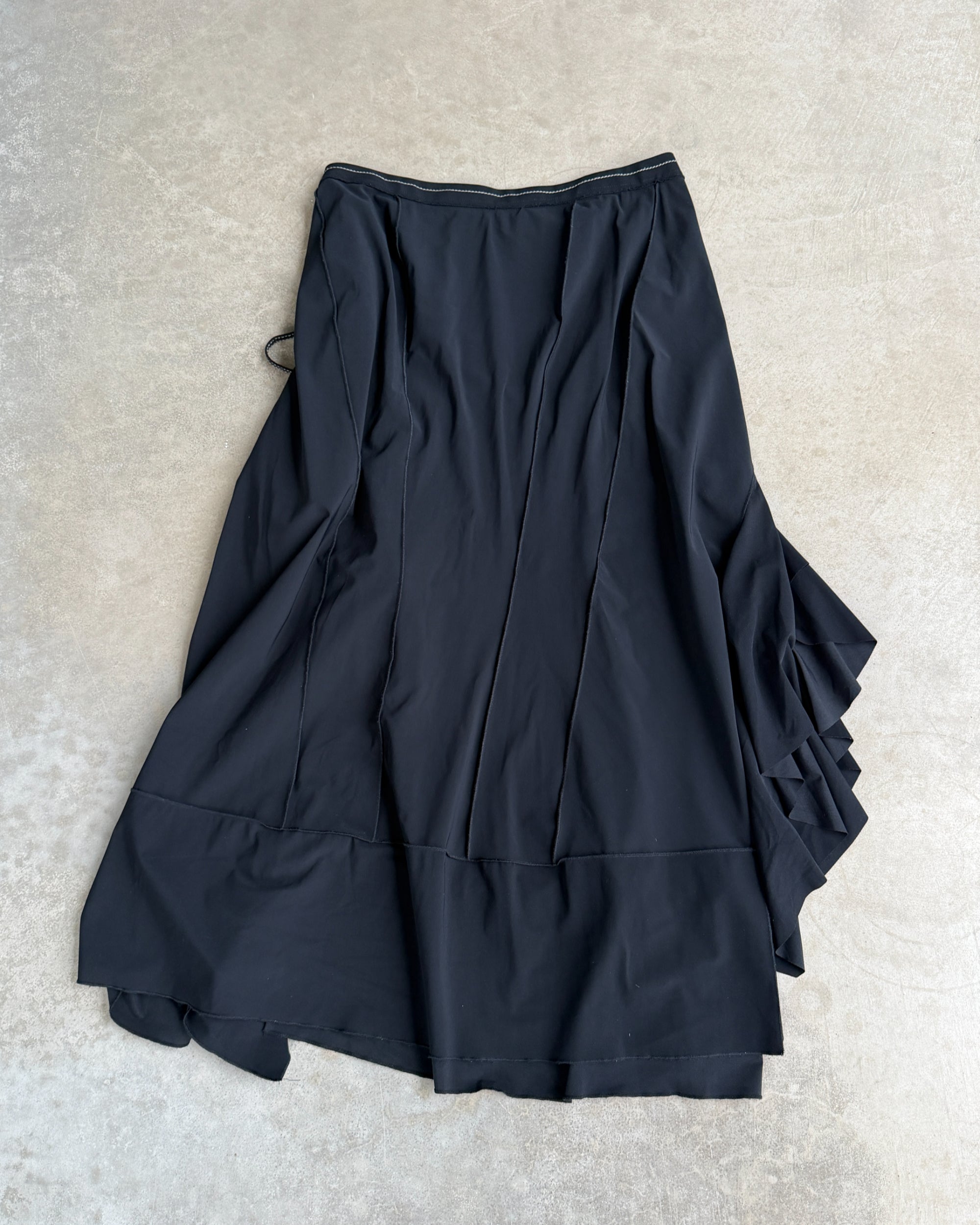 Marithé + François Girbaud Asymmetric Maxi Skirt – S-on a concrete background
