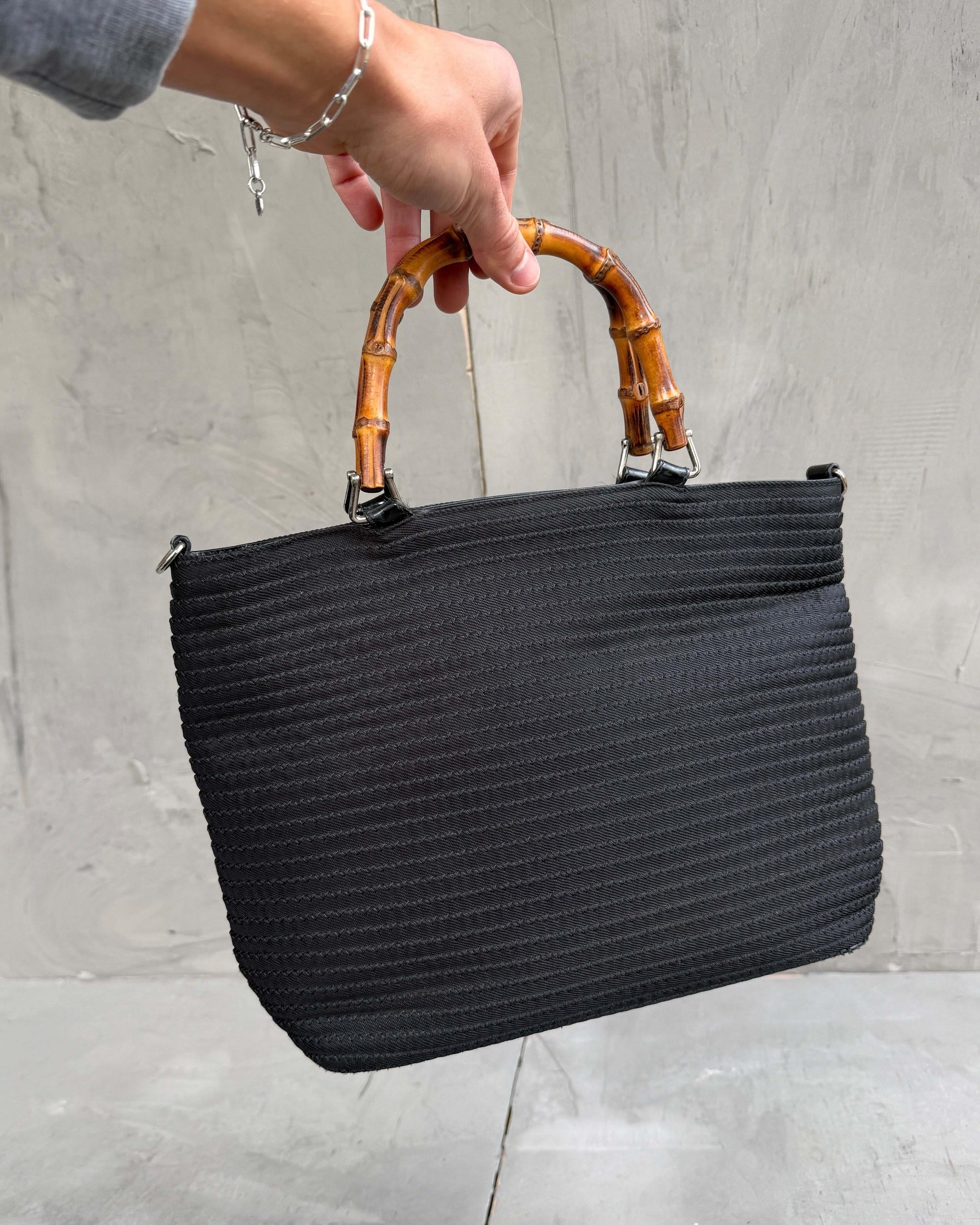 Gucci Bamboo Handle Handbag-on a concrete background