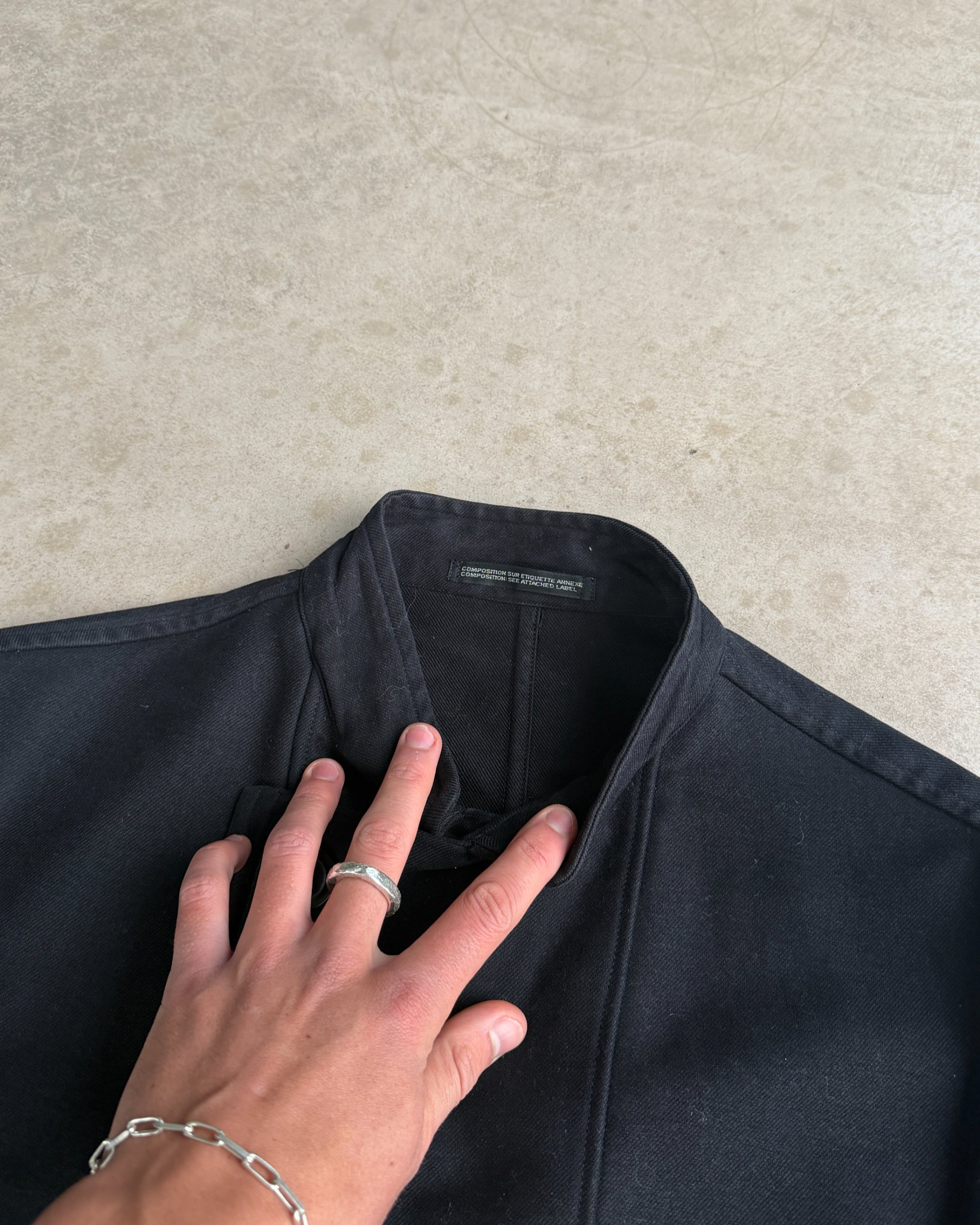 Yohji Yamamoto AW06 Asymmetric Cotton Jacket – S-on a concrete background