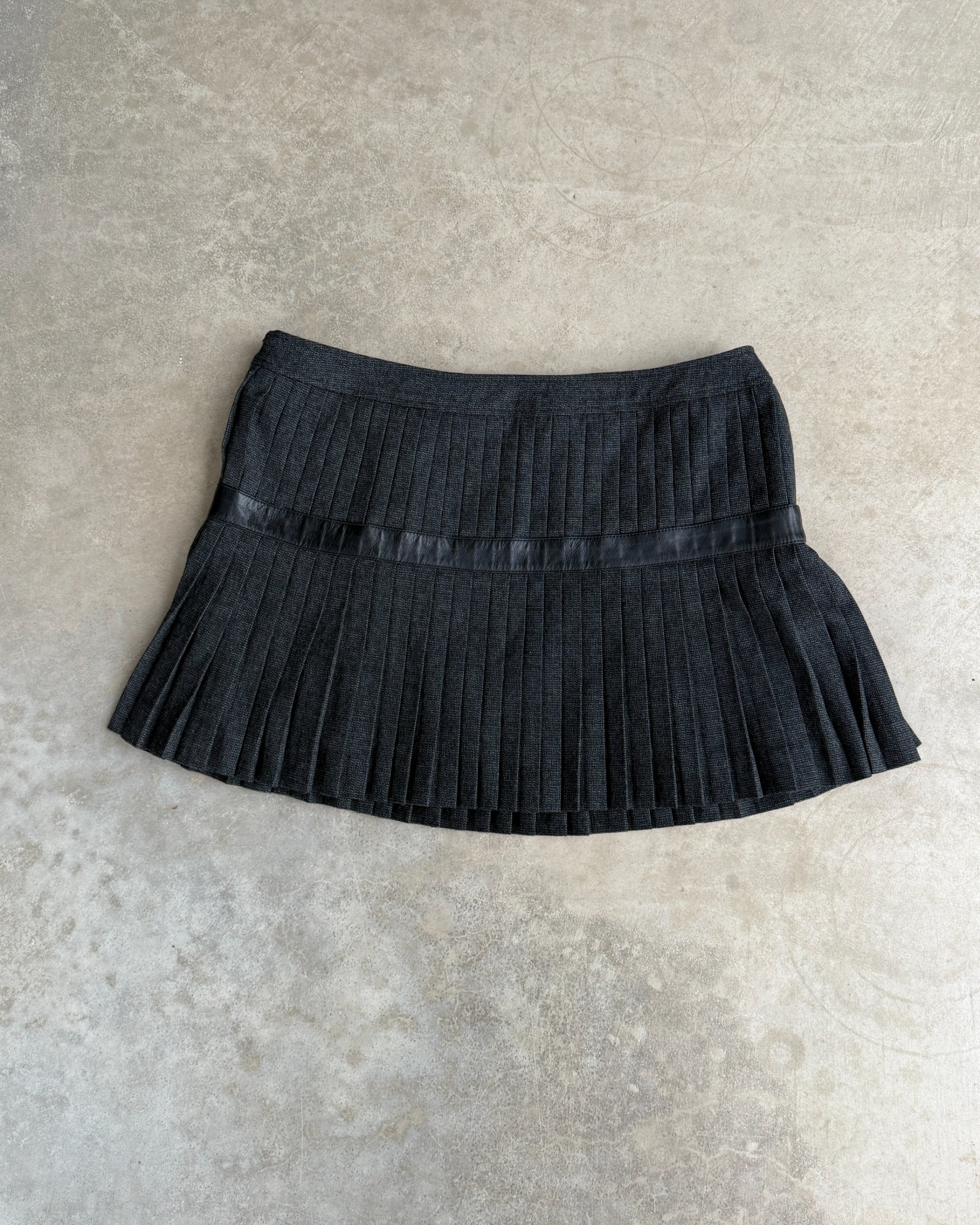 Dolce and Gabbana D&G Pleated Mini Skirt – M-on a concrete background
