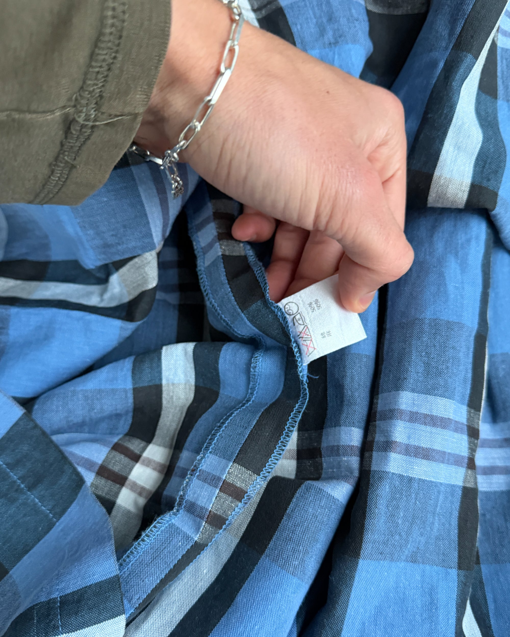 Issey Miyake IS Checkered Dress – M-on a concrete background