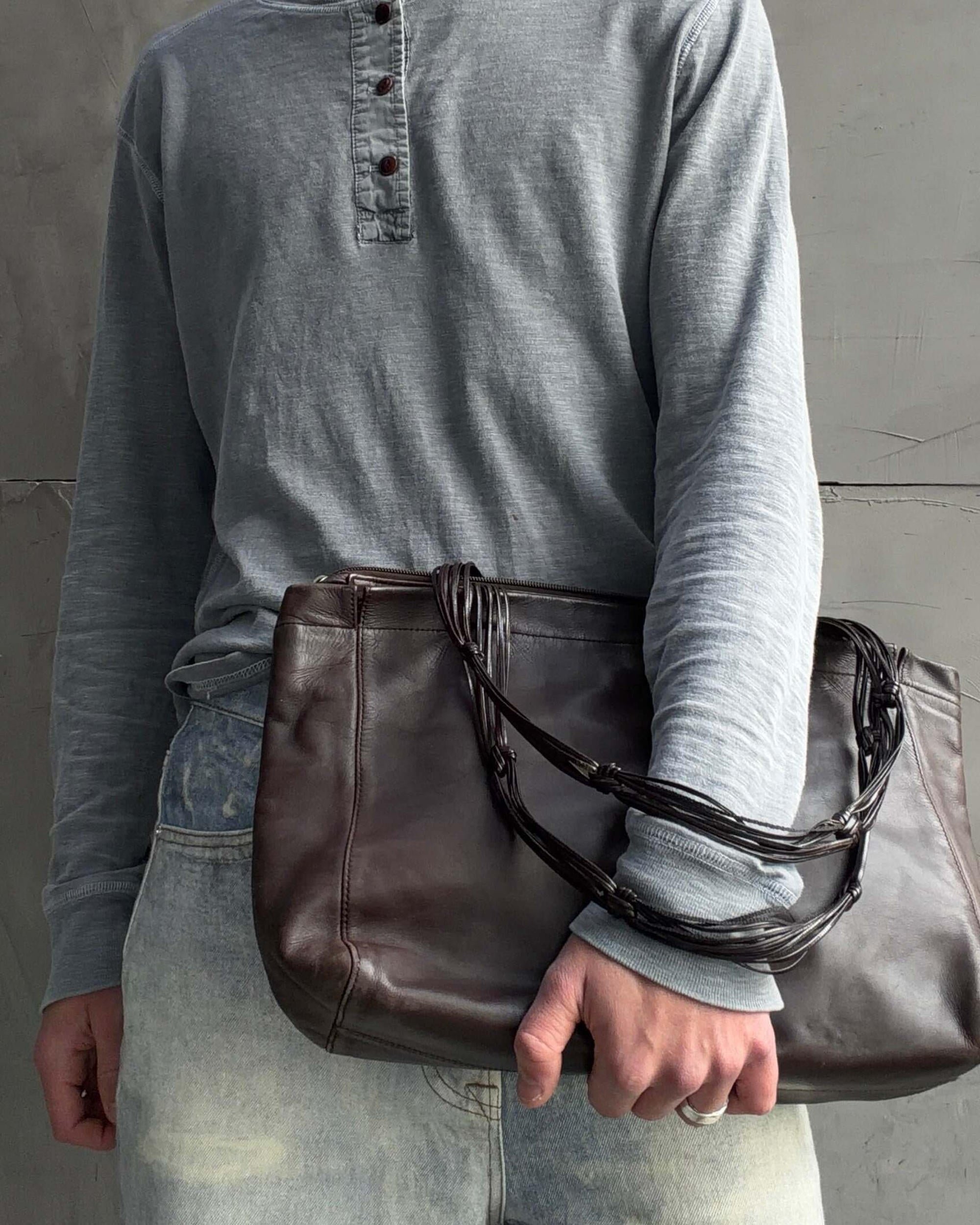 Stephane Kellan Leather Tote Bag-on a concrete background