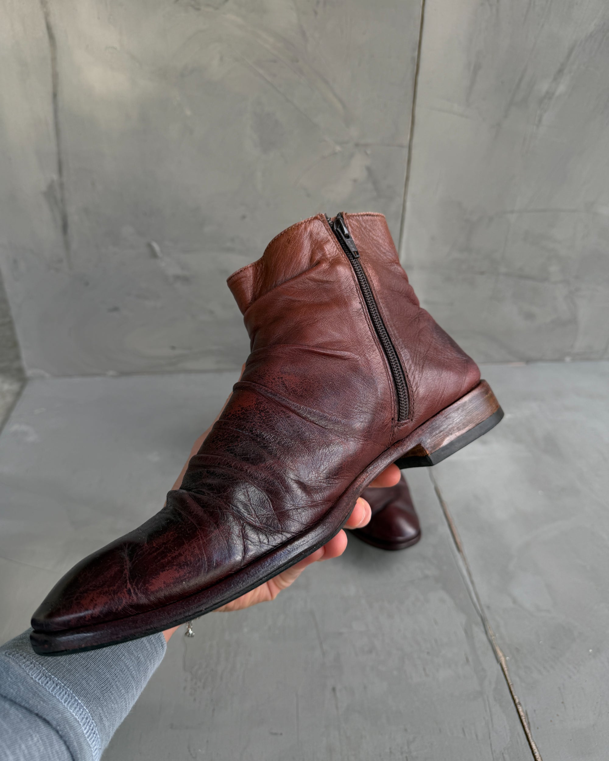 Sole Made in London Creased Leather Ankle Boots – EU 43-on a concrete background
