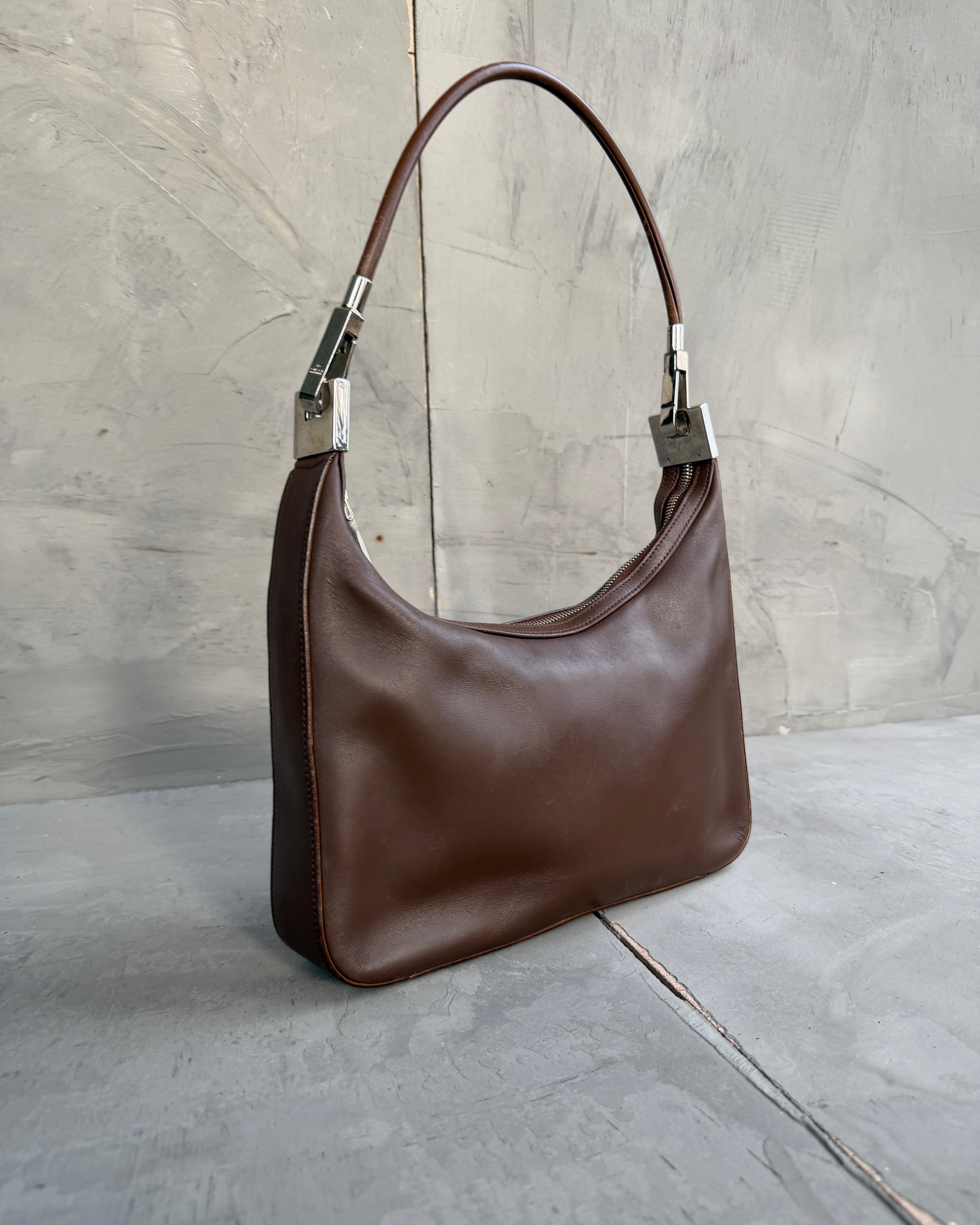 Gucci Asymmetric Structured Leather Shoulder Bag-on a concrete background