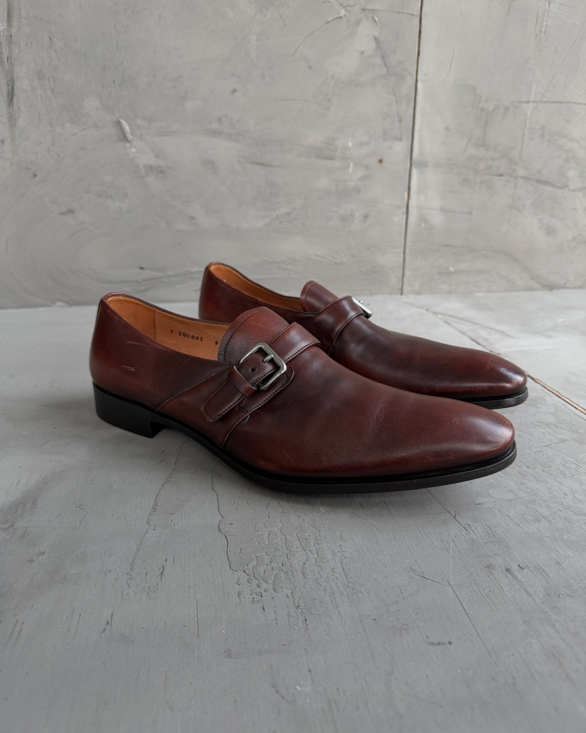Prada Buckle Leather Derbys – UK 9-on a concrete background