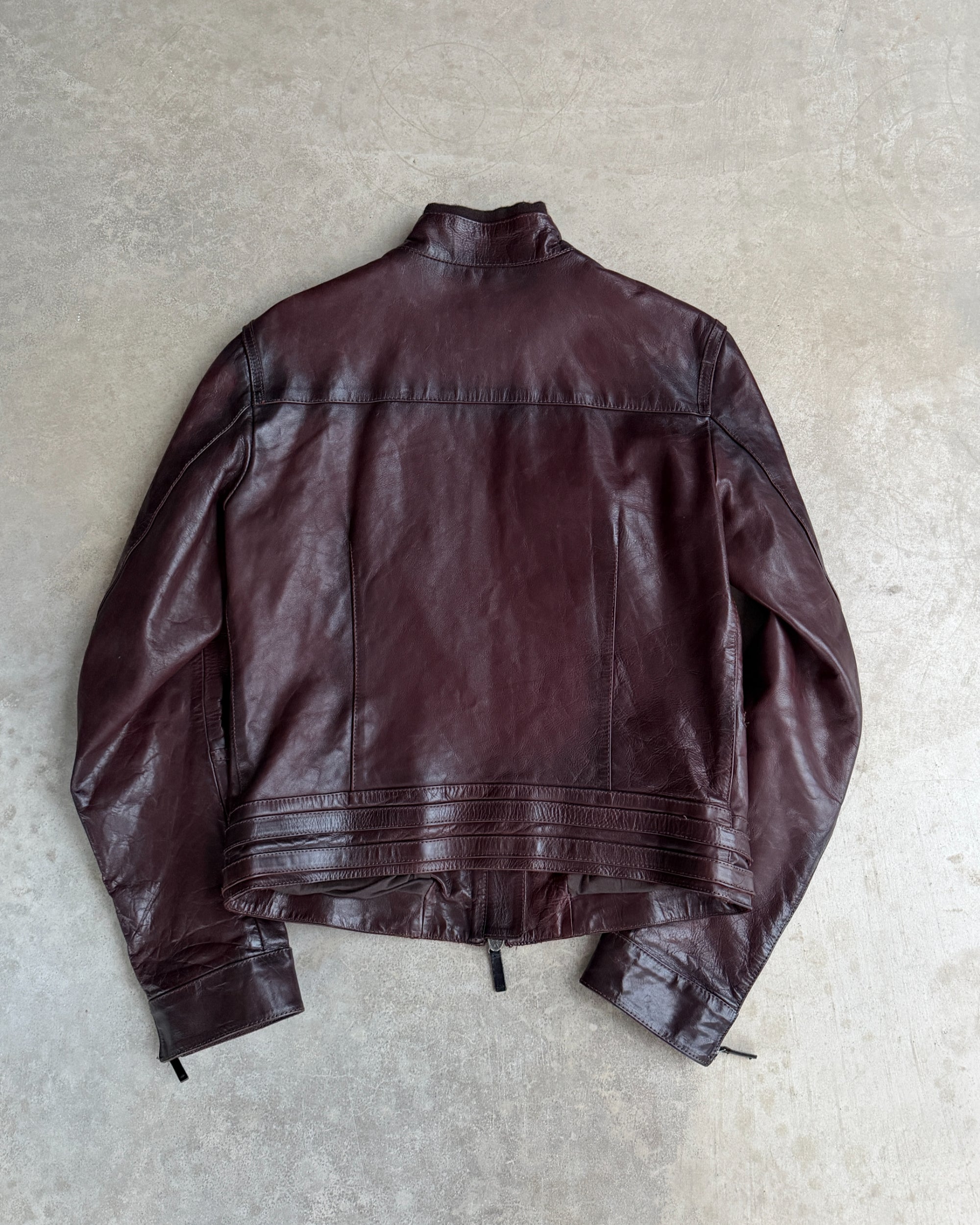 Calvin Klein Buckle Leather Jacket – M-on a concrete background