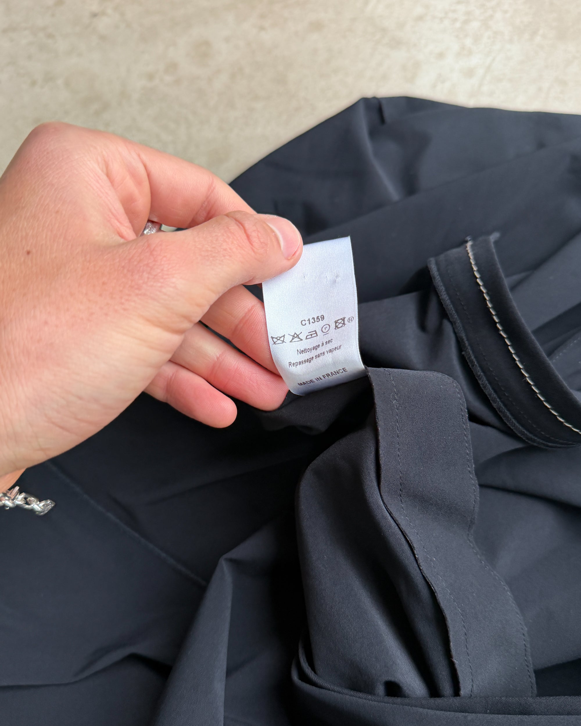 Marithé + François Girbaud Asymmetric Maxi Skirt – S-on a concrete background