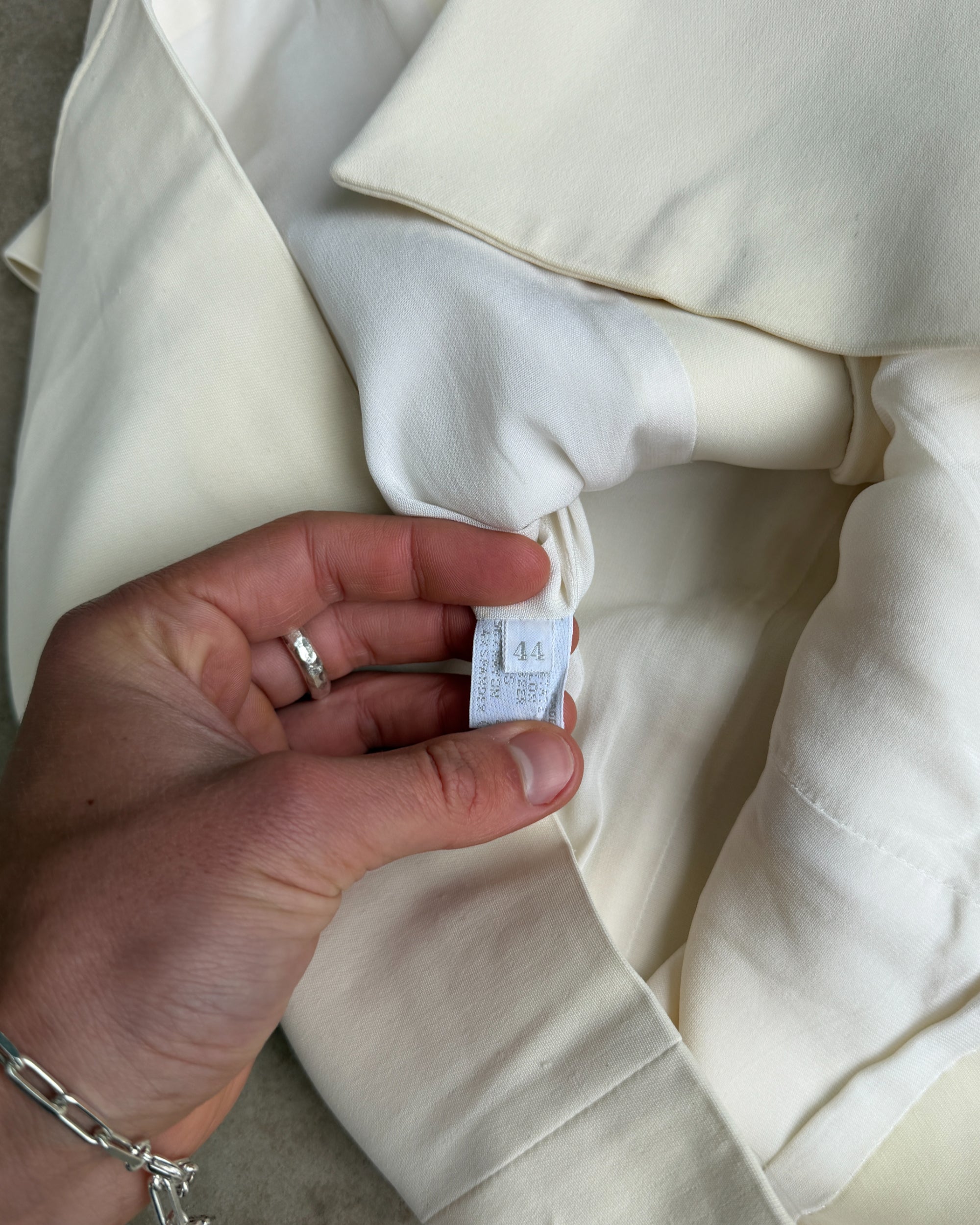 Prada Padded Shoulder Short Sleeve Shirt – M-on a concrete background