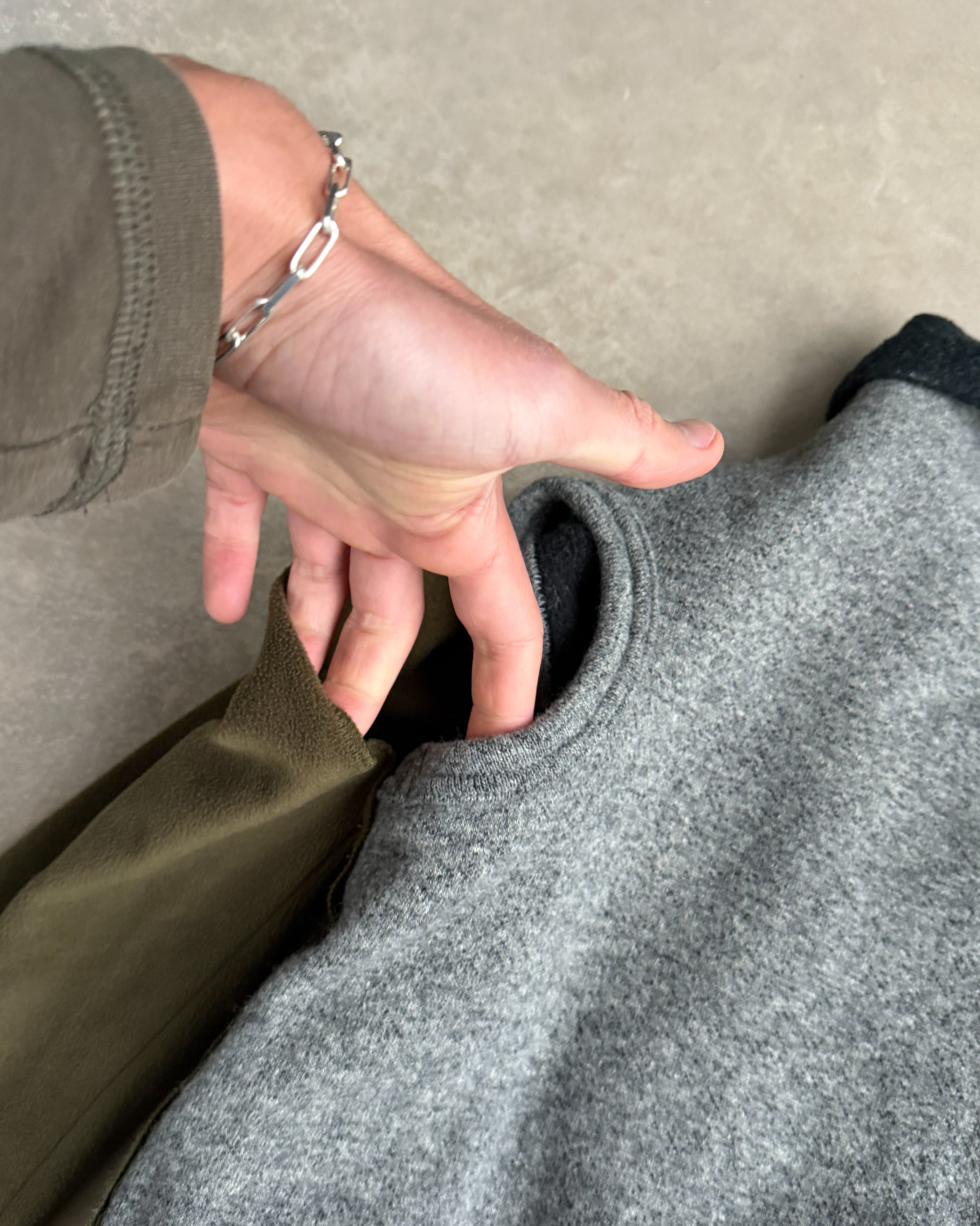 Comme des Garçons 2009 Layered Armhole Cardigan – XS–S-on a concrete background