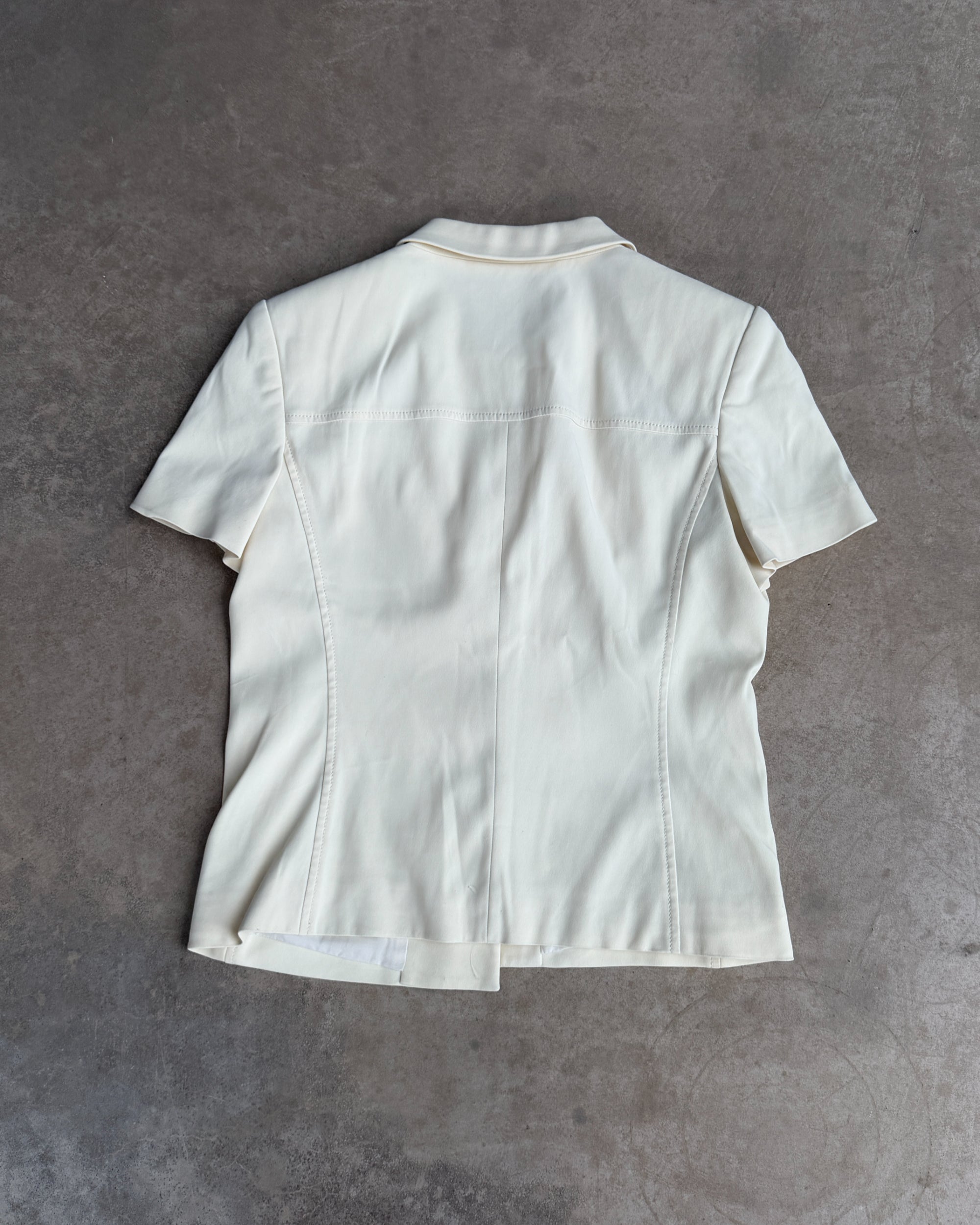 Prada Padded Shoulder Short Sleeve Shirt – M-on a concrete background