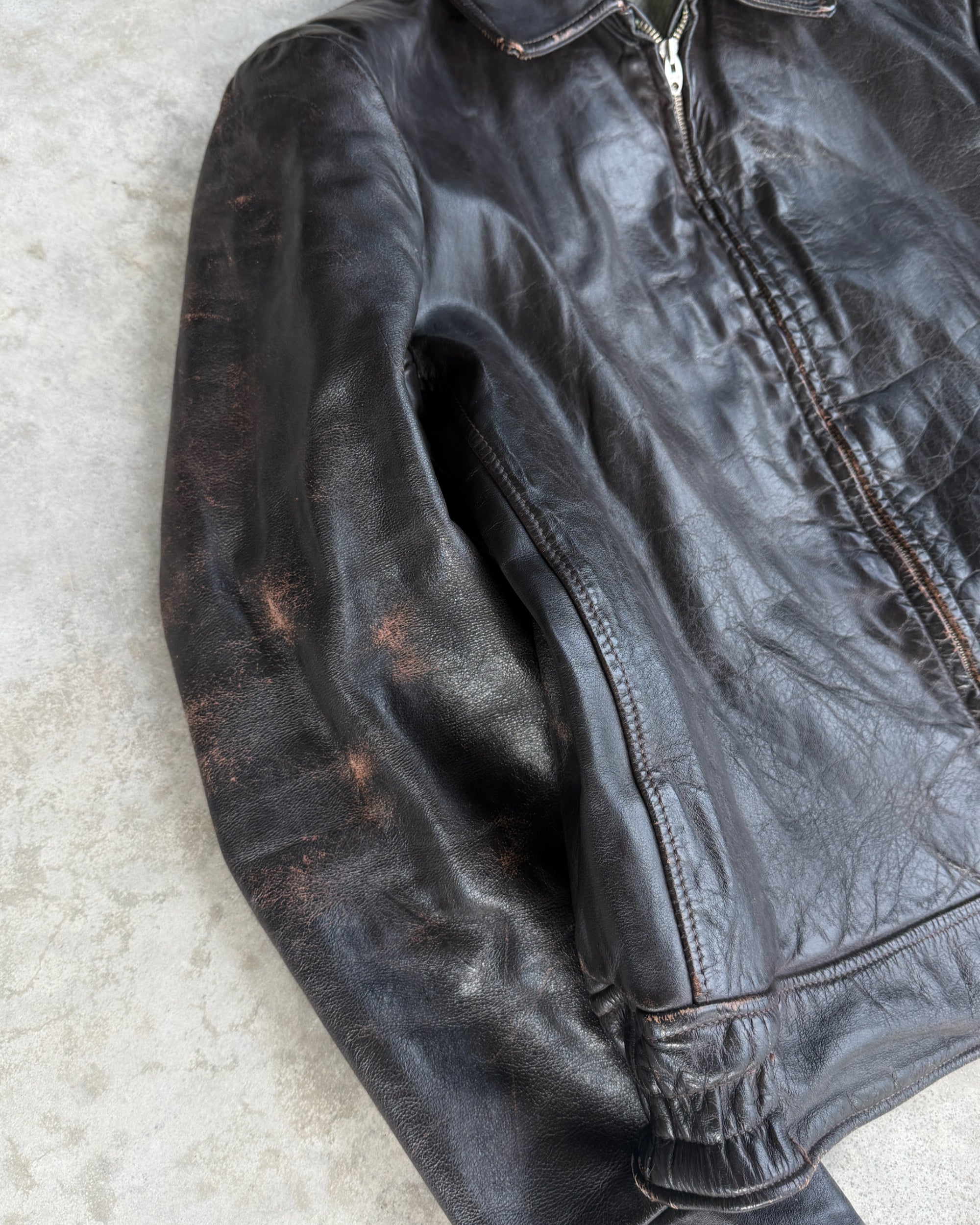 1970s Vintage Leather Jacket with Wool Lining – S-on a concrete background