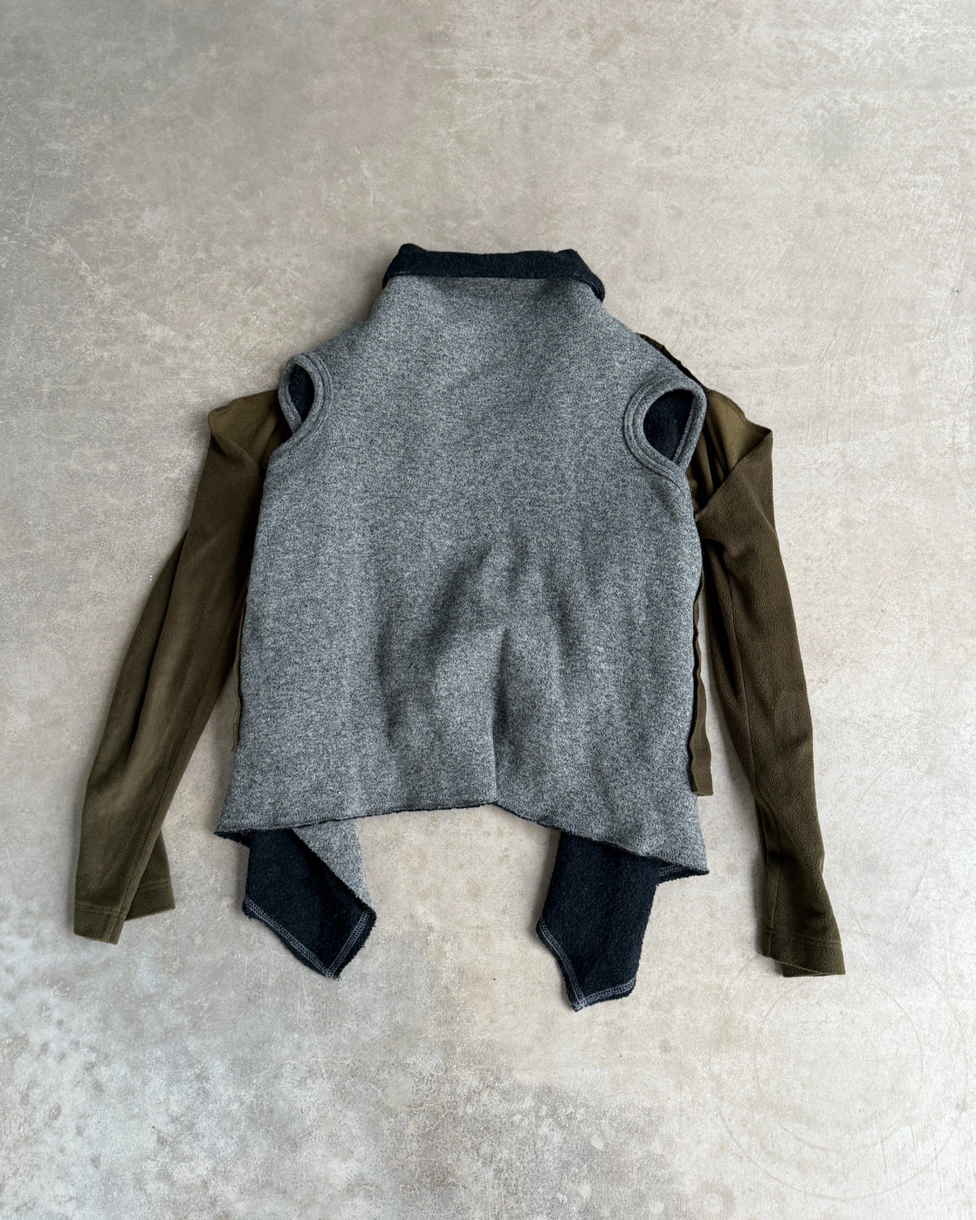 Comme des Garçons 2009 Layered Armhole Cardigan – XS–S-on a concrete background