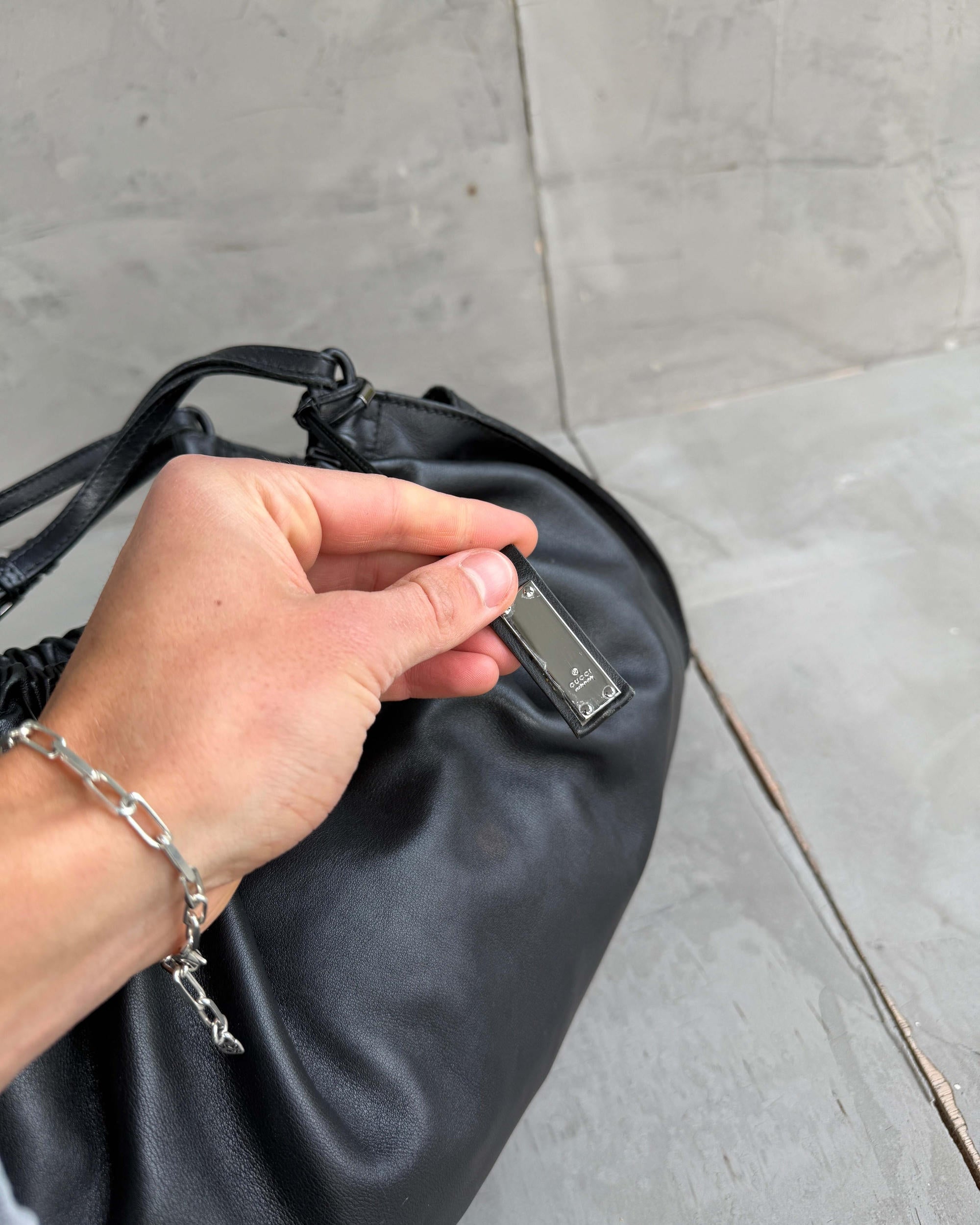 Gucci by Tom Ford Ruched Leather Shoulder Bag-on a concrete background